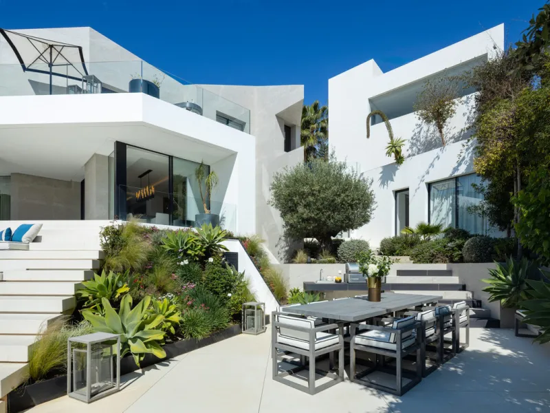 This is a contemporary 5-bedroom luxury villa for sale in the prestigious La Quinta Golf Resort, Benahavís, offering panoramic views and exceptional modern living in one of the Costa del Sol's most desirable gated communities.