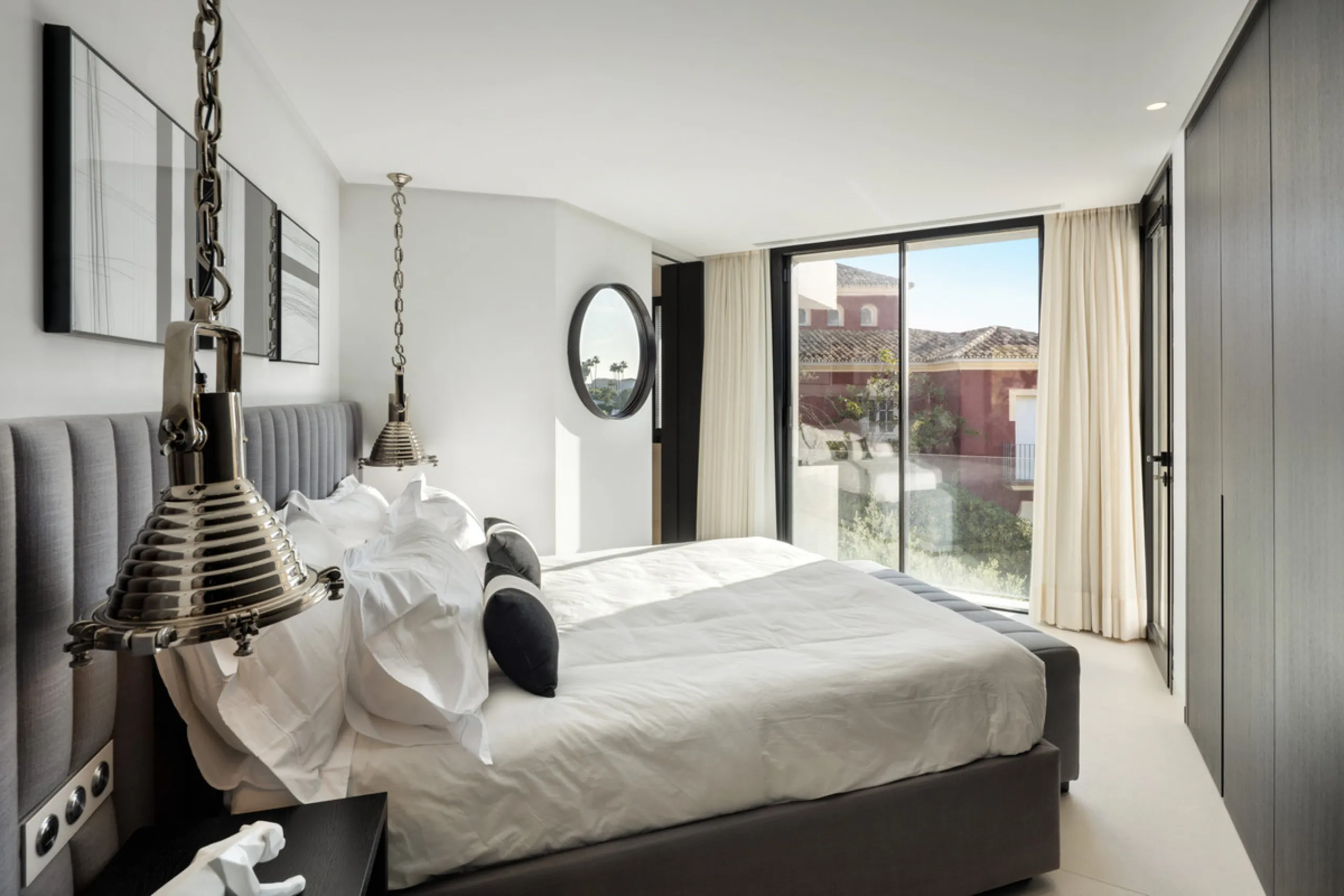 This is a contemporary 5-bedroom luxury villa for sale in the prestigious La Quinta Golf Resort, Benahavís, offering panoramic views and exceptional modern living in one of the Costa del Sol's most desirable gated communities.