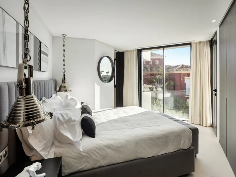 This is a contemporary 5-bedroom luxury villa for sale in the prestigious La Quinta Golf Resort, Benahavís, offering panoramic views and exceptional modern living in one of the Costa del Sol's most desirable gated communities.