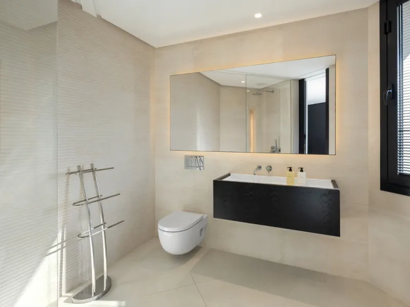 This is a contemporary 5-bedroom luxury villa for sale in the prestigious La Quinta Golf Resort, Benahavís, offering panoramic views and exceptional modern living in one of the Costa del Sol's most desirable gated communities.