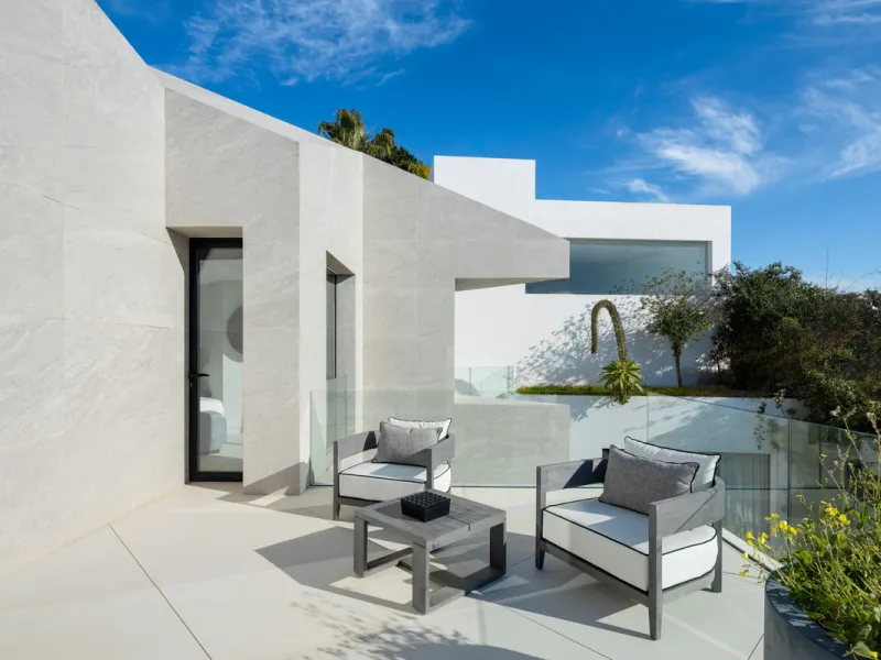 This is a contemporary 5-bedroom luxury villa for sale in the prestigious La Quinta Golf Resort, Benahavís, offering panoramic views and exceptional modern living in one of the Costa del Sol's most desirable gated communities.