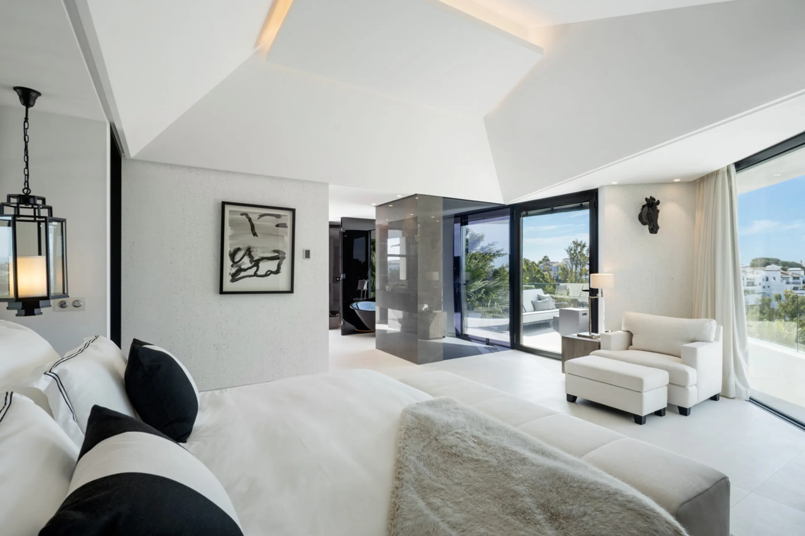 This is a contemporary 5-bedroom luxury villa for sale in the prestigious La Quinta Golf Resort, Benahavís, offering panoramic views and exceptional modern living in one of the Costa del Sol's most desirable gated communities.