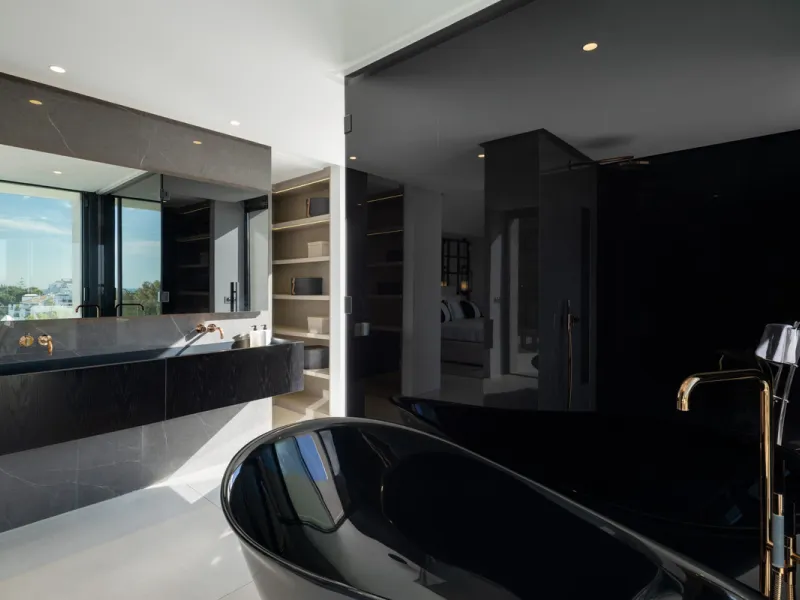 This is a contemporary 5-bedroom luxury villa for sale in the prestigious La Quinta Golf Resort, Benahavís, offering panoramic views and exceptional modern living in one of the Costa del Sol's most desirable gated communities.