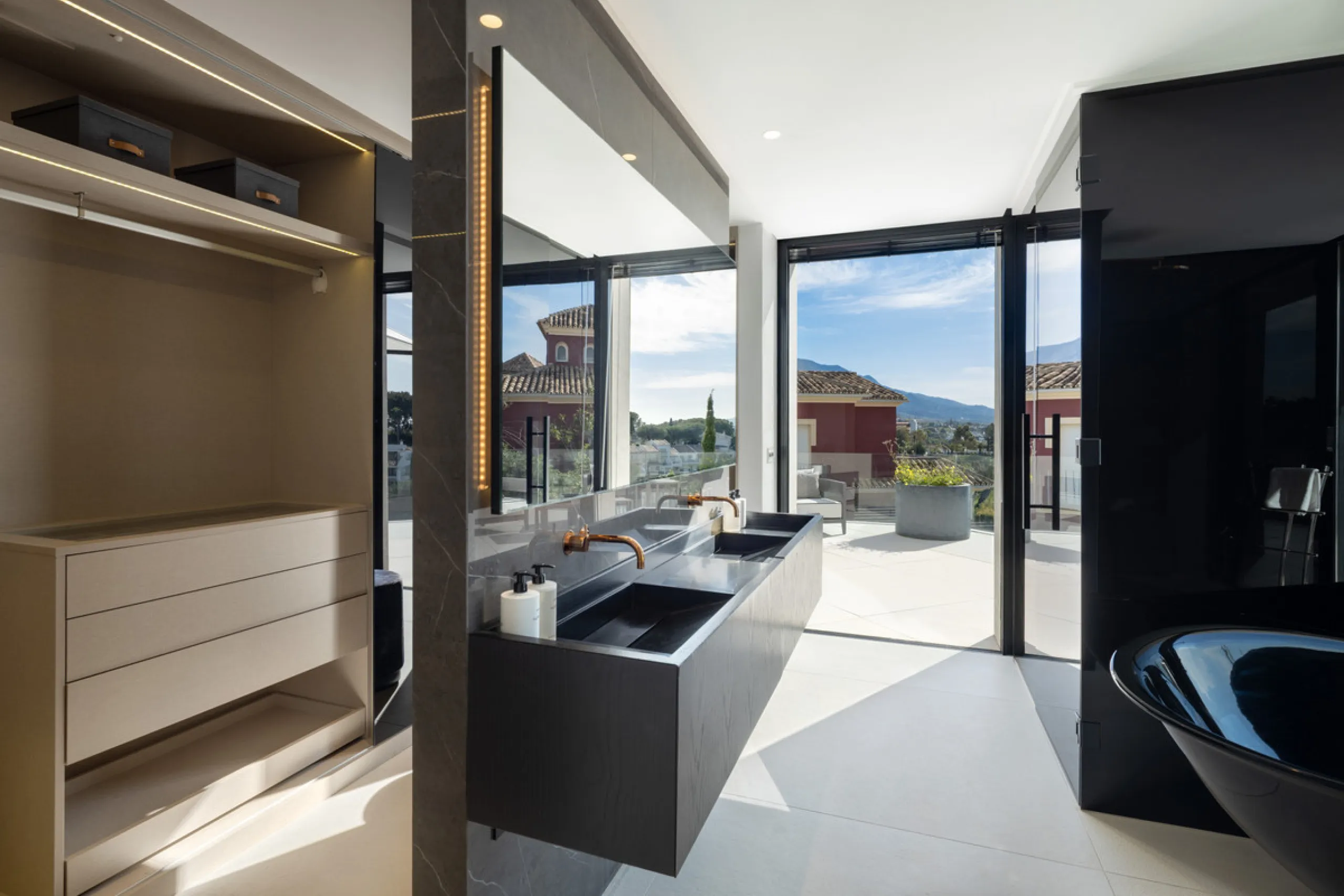 This is a contemporary 5-bedroom luxury villa for sale in the prestigious La Quinta Golf Resort, Benahavís, offering panoramic views and exceptional modern living in one of the Costa del Sol's most desirable gated communities.