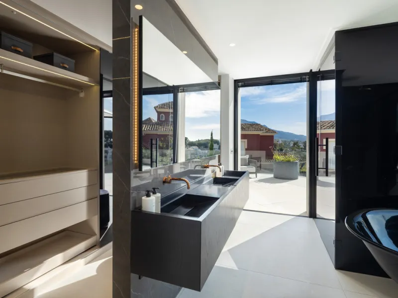 This is a contemporary 5-bedroom luxury villa for sale in the prestigious La Quinta Golf Resort, Benahavís, offering panoramic views and exceptional modern living in one of the Costa del Sol's most desirable gated communities.