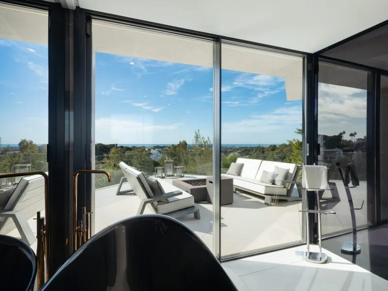 This is a contemporary 5-bedroom luxury villa for sale in the prestigious La Quinta Golf Resort, Benahavís, offering panoramic views and exceptional modern living in one of the Costa del Sol's most desirable gated communities.