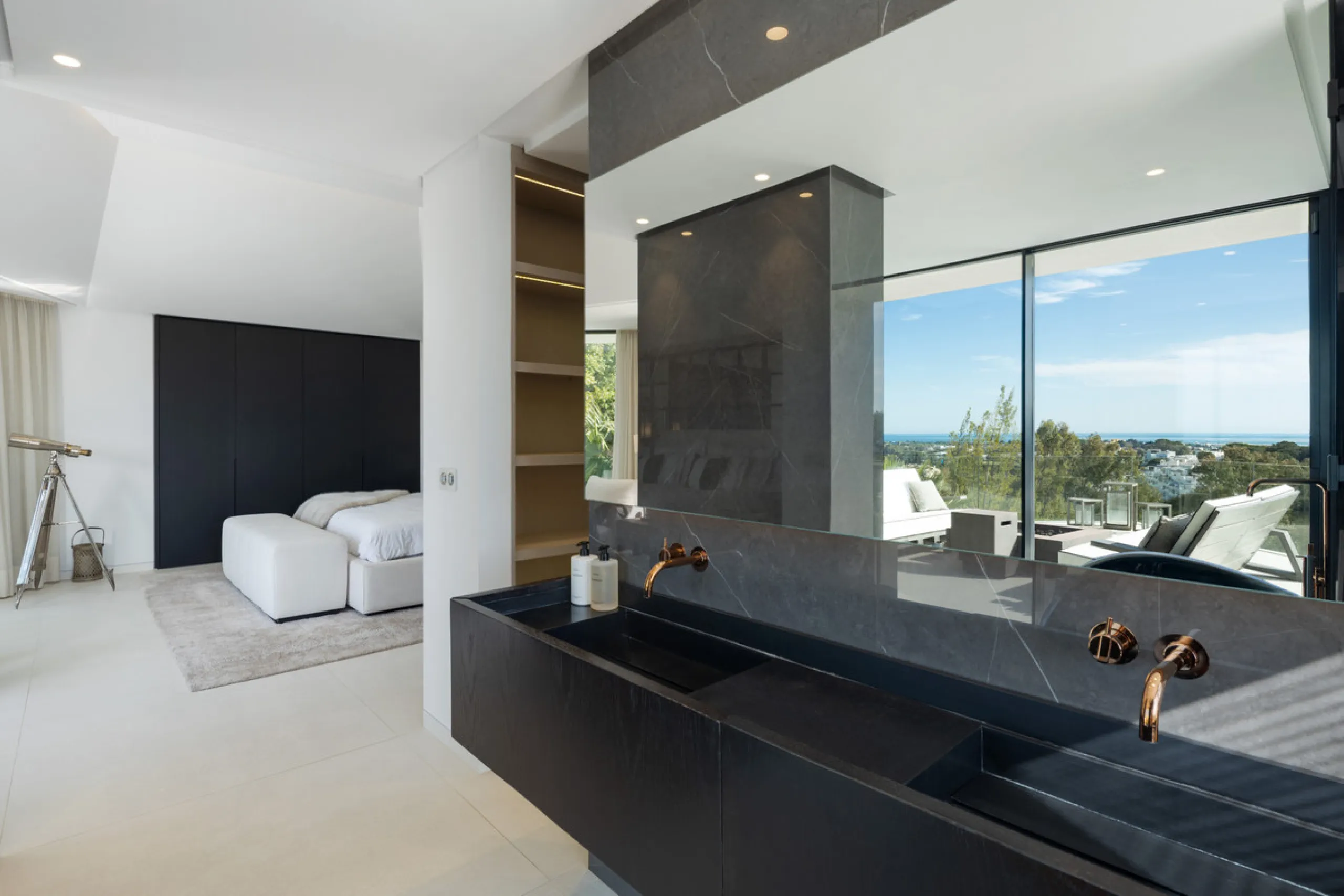 This is a contemporary 5-bedroom luxury villa for sale in the prestigious La Quinta Golf Resort, Benahavís, offering panoramic views and exceptional modern living in one of the Costa del Sol's most desirable gated communities.