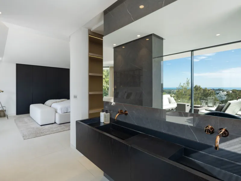 This is a contemporary 5-bedroom luxury villa for sale in the prestigious La Quinta Golf Resort, Benahavís, offering panoramic views and exceptional modern living in one of the Costa del Sol's most desirable gated communities.