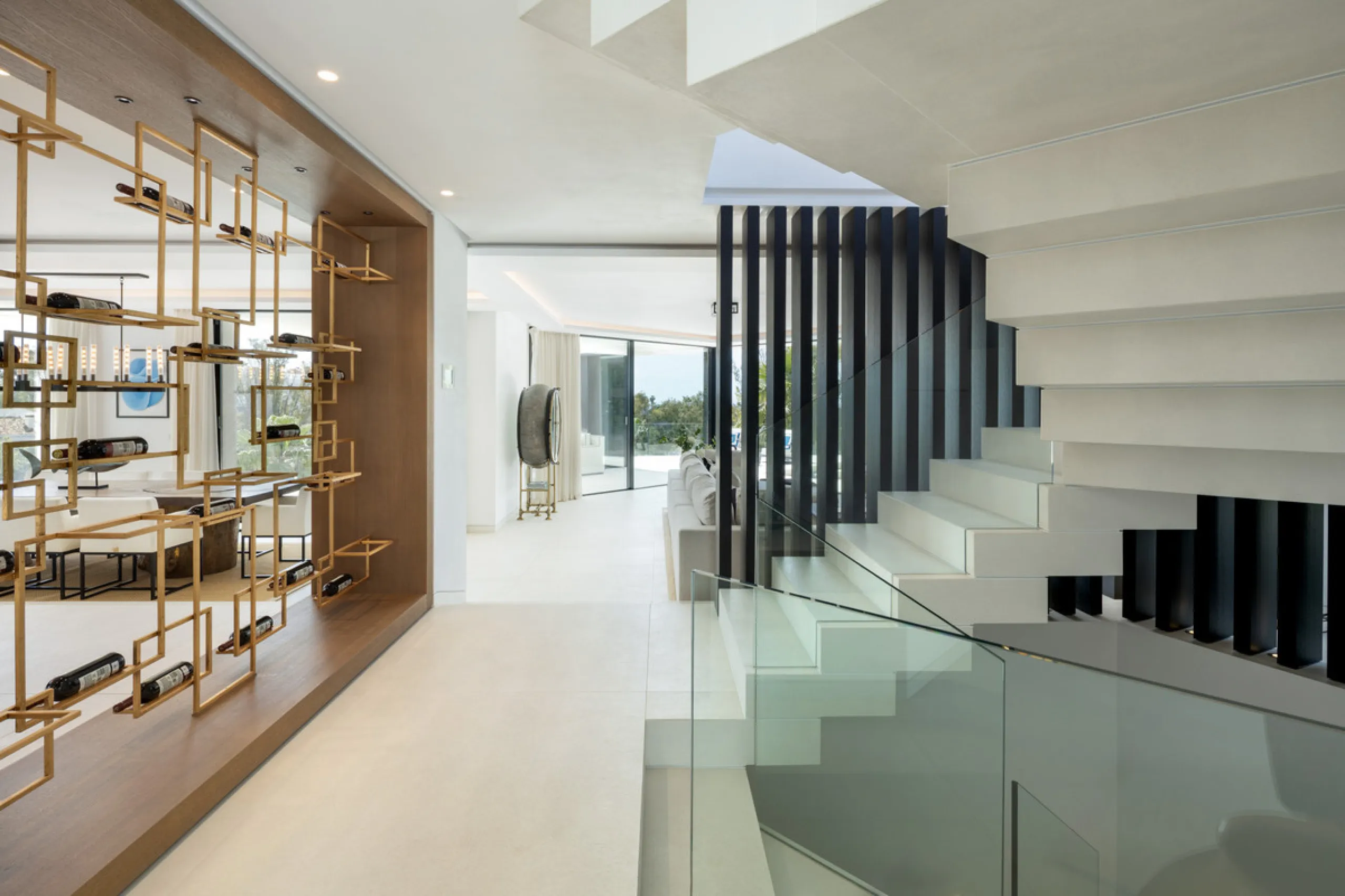 This is a contemporary 5-bedroom luxury villa for sale in the prestigious La Quinta Golf Resort, Benahavís, offering panoramic views and exceptional modern living in one of the Costa del Sol's most desirable gated communities.