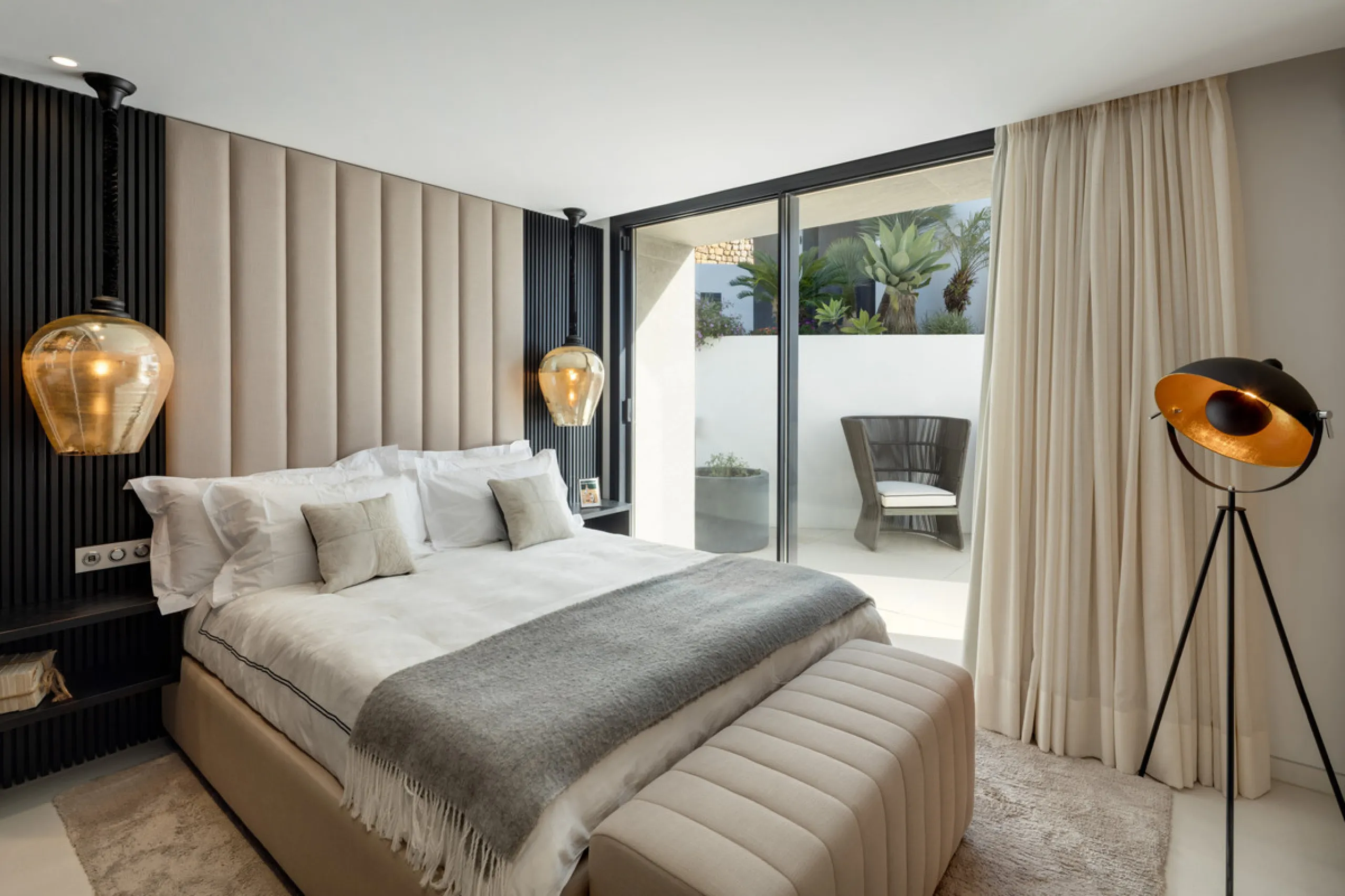 This is a contemporary 5-bedroom luxury villa for sale in the prestigious La Quinta Golf Resort, Benahavís, offering panoramic views and exceptional modern living in one of the Costa del Sol's most desirable gated communities.