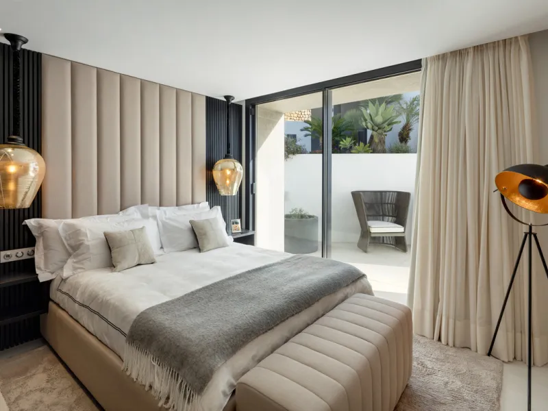 This is a contemporary 5-bedroom luxury villa for sale in the prestigious La Quinta Golf Resort, Benahavís, offering panoramic views and exceptional modern living in one of the Costa del Sol's most desirable gated communities.
