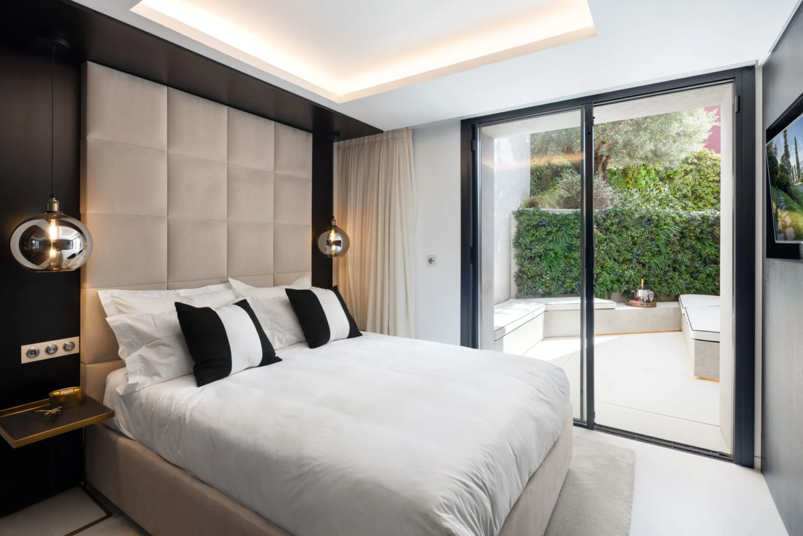 This is a contemporary 5-bedroom luxury villa for sale in the prestigious La Quinta Golf Resort, Benahavís, offering panoramic views and exceptional modern living in one of the Costa del Sol's most desirable gated communities.