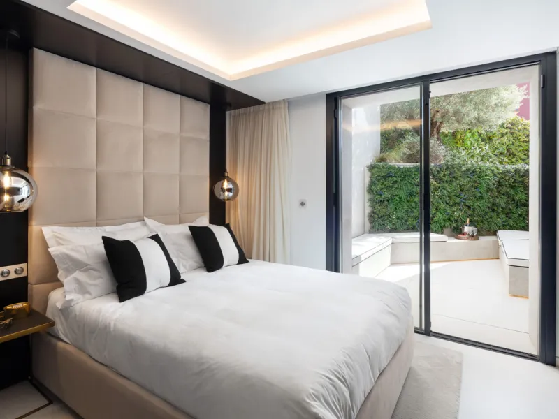 This is a contemporary 5-bedroom luxury villa for sale in the prestigious La Quinta Golf Resort, Benahavís, offering panoramic views and exceptional modern living in one of the Costa del Sol's most desirable gated communities.
