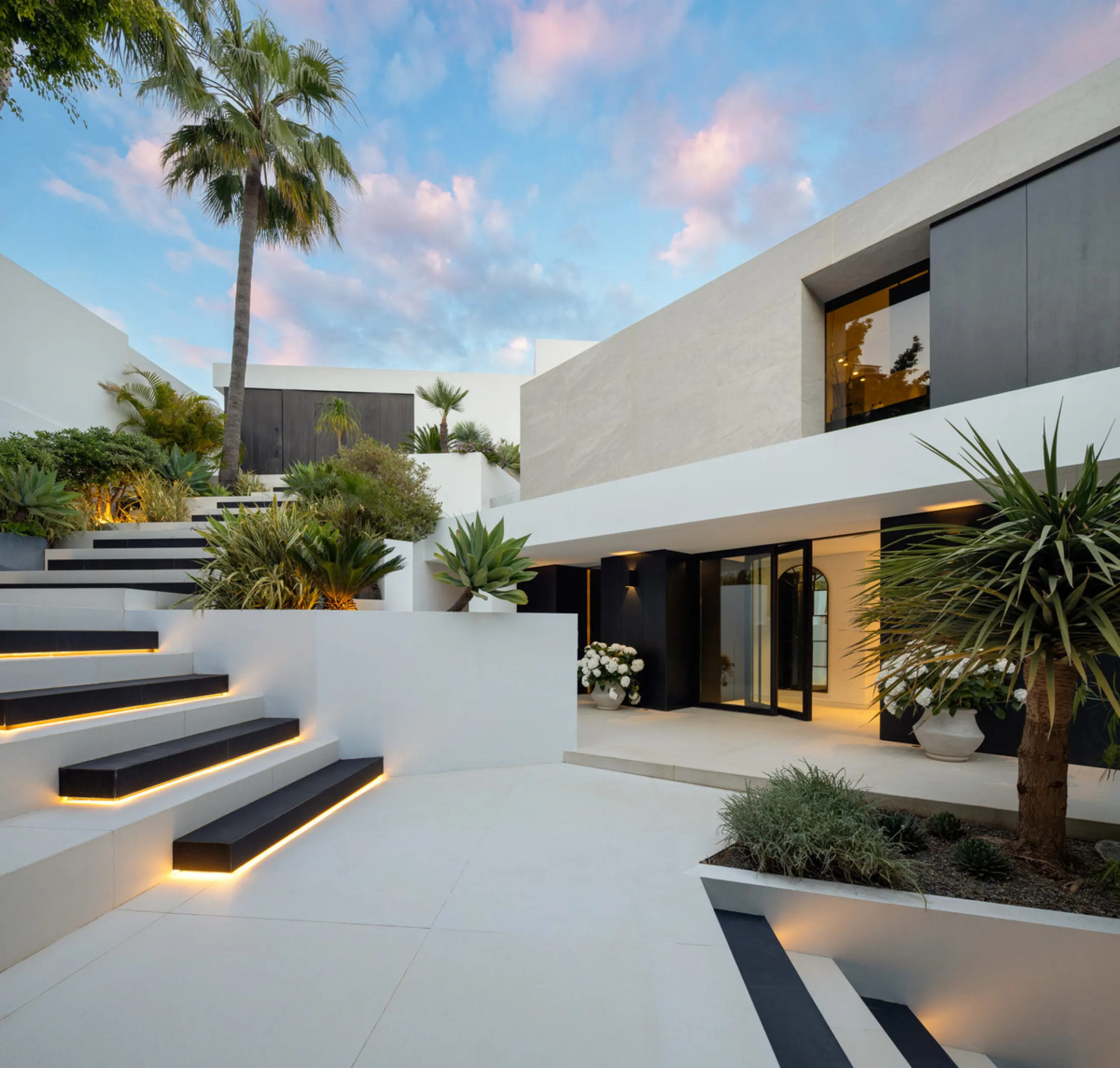 This is a contemporary 5-bedroom luxury villa for sale in the prestigious La Quinta Golf Resort, Benahavís, offering panoramic views and exceptional modern living in one of the Costa del Sol's most desirable gated communities.