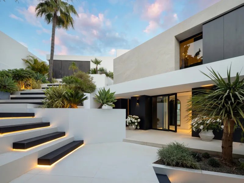 This is a contemporary 5-bedroom luxury villa for sale in the prestigious La Quinta Golf Resort, Benahavís, offering panoramic views and exceptional modern living in one of the Costa del Sol's most desirable gated communities.