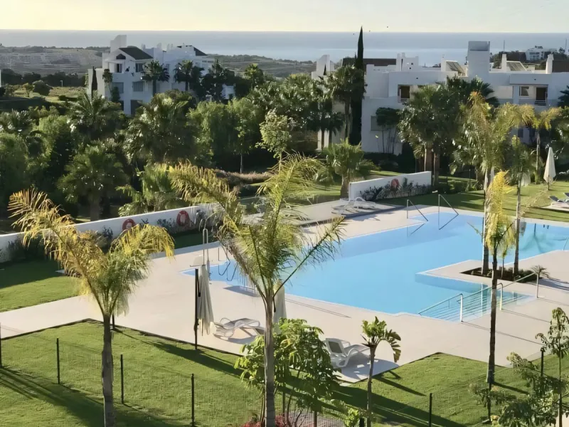 We are pleased to present this bright; modern  and stunning elevated ground floor apartment in the heart of  Casares; Alcazaba lagoon.  The open-concept living area seamlessly connects to a modern dining space, creating a comfortable environment filled wi