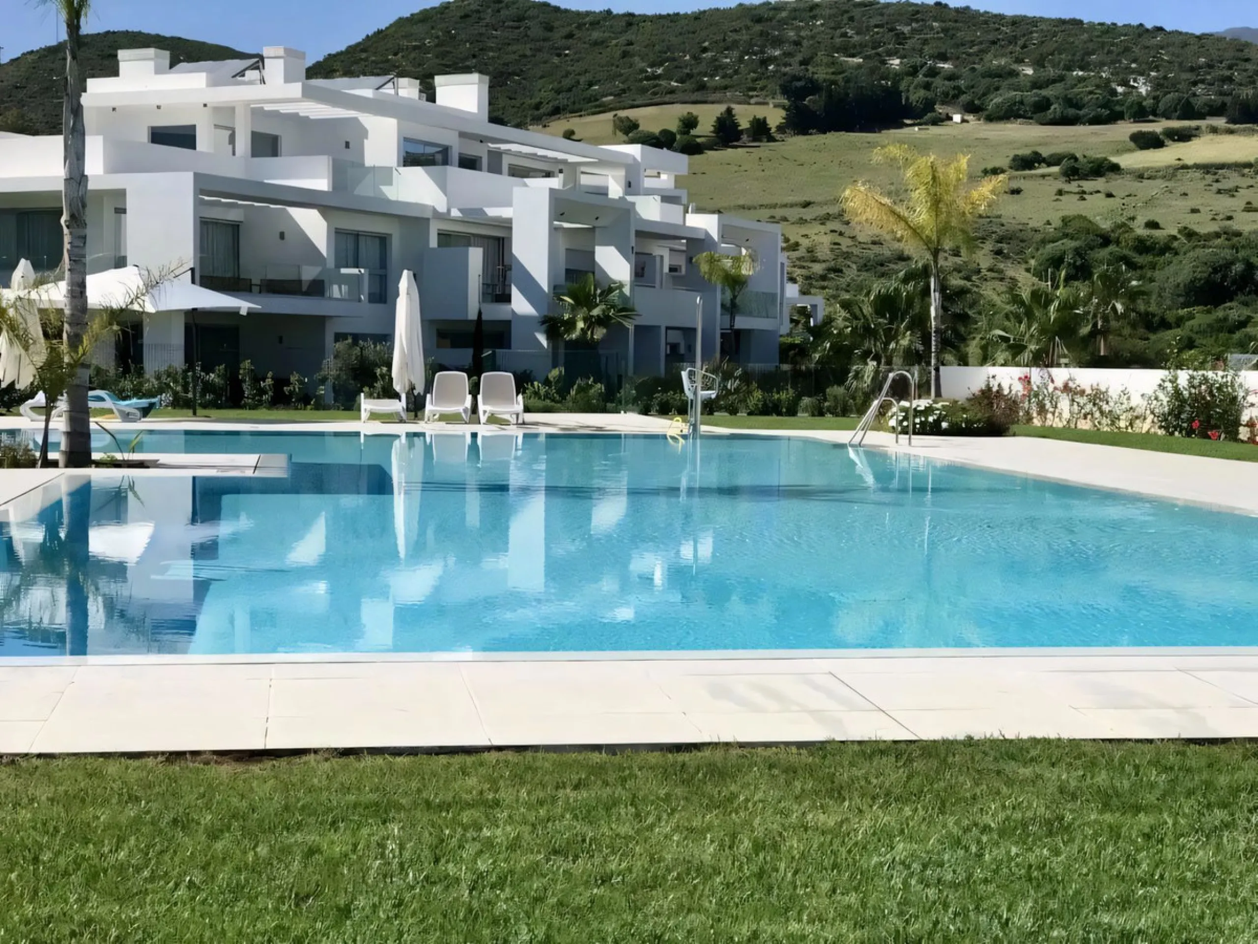 We are pleased to present this bright; modern  and stunning elevated ground floor apartment in the heart of  Casares; Alcazaba lagoon.  The open-concept living area seamlessly connects to a modern dining space, creating a comfortable environment filled wi