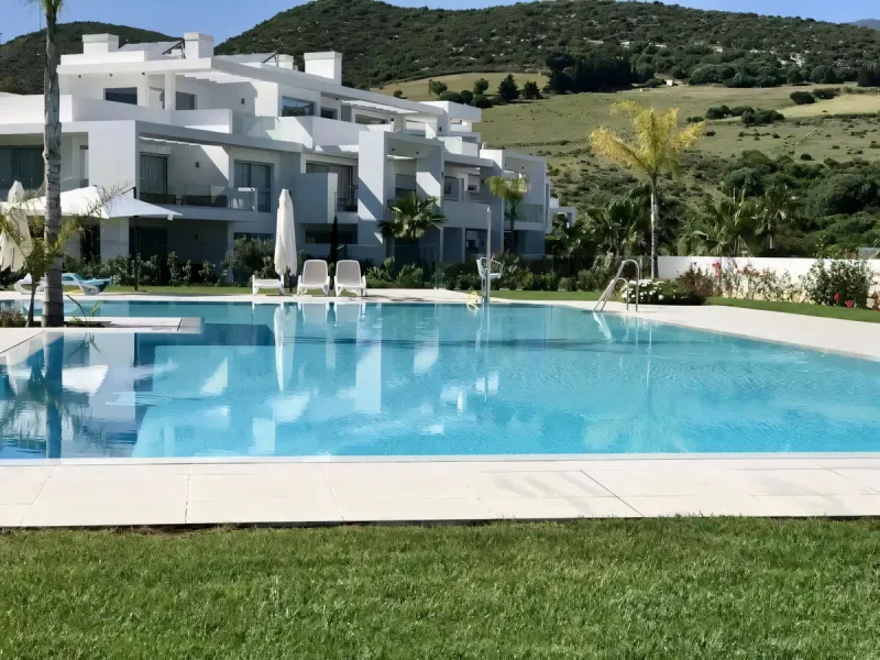 We are pleased to present this bright; modern  and stunning elevated ground floor apartment in the heart of  Casares; Alcazaba lagoon.  The open-concept living area seamlessly connects to a modern dining space, creating a comfortable environment filled wi