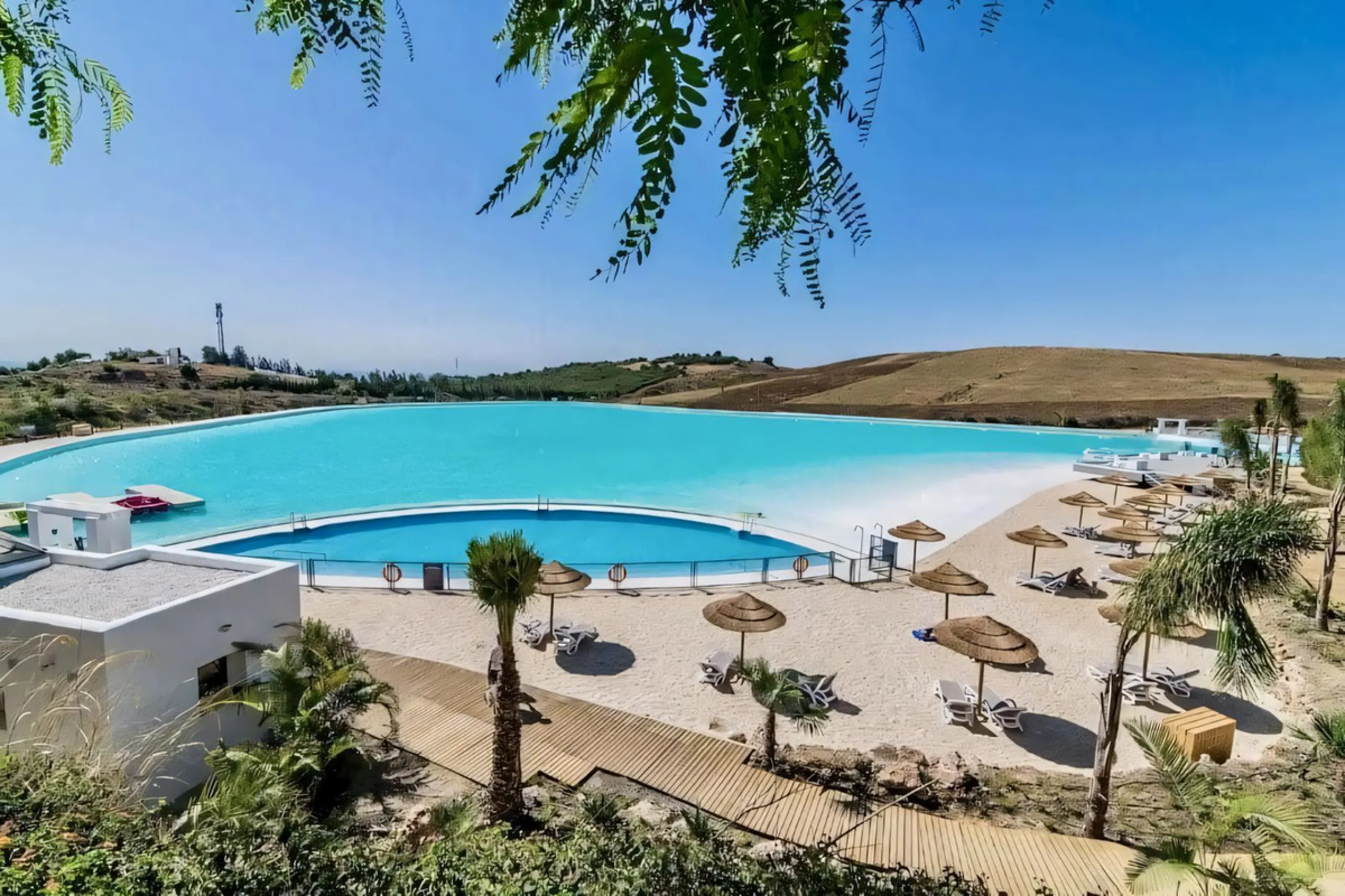 We are pleased to present this bright; modern  and stunning elevated ground floor apartment in the heart of  Casares; Alcazaba lagoon.  The open-concept living area seamlessly connects to a modern dining space, creating a comfortable environment filled wi