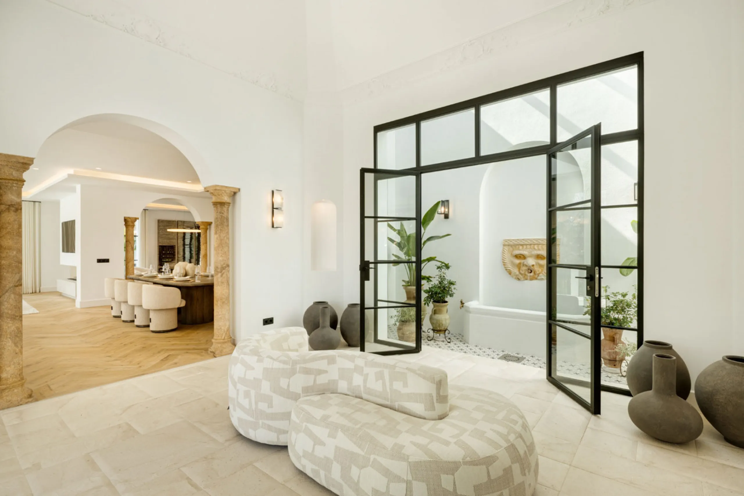 Exceptional villa for sale in the prestigious gated community of El Herrojo Alto, one of La Quinta's most sought-after residential areas. Positioned on an elevated frontline golf plot, this landmark property harmoniously blends timeless Andalusian archite