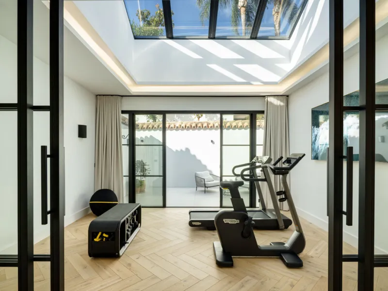 Exceptional villa for sale in the prestigious gated community of El Herrojo Alto, one of La Quinta's most sought-after residential areas. Positioned on an elevated frontline golf plot, this landmark property harmoniously blends timeless Andalusian archite