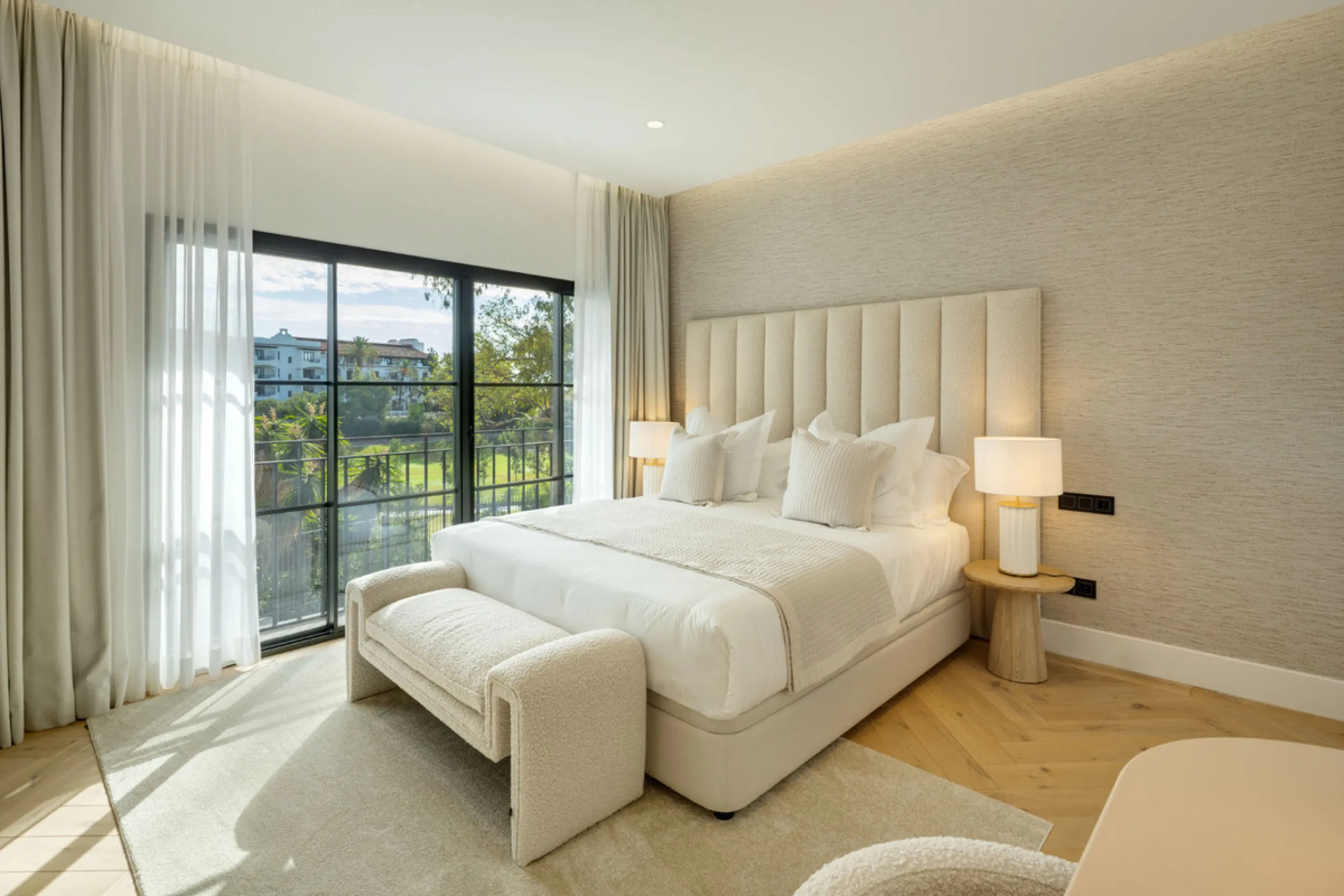 Exceptional villa for sale in the prestigious gated community of El Herrojo Alto, one of La Quinta's most sought-after residential areas. Positioned on an elevated frontline golf plot, this landmark property harmoniously blends timeless Andalusian archite