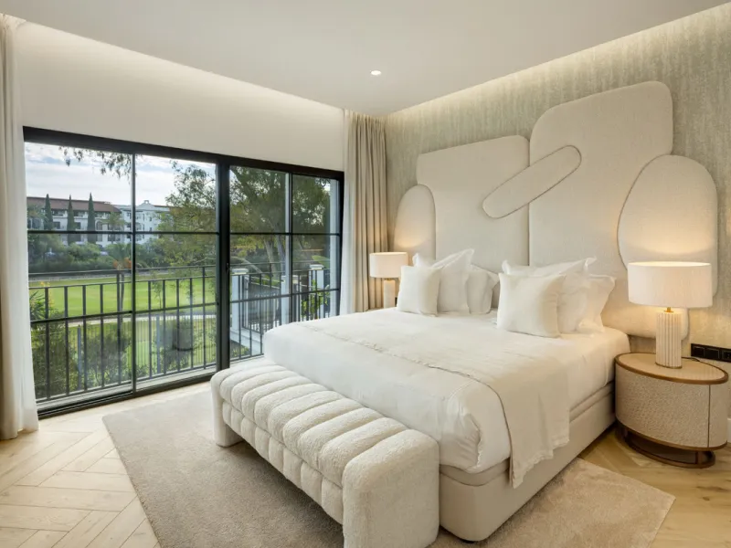 Exceptional villa for sale in the prestigious gated community of El Herrojo Alto, one of La Quinta's most sought-after residential areas. Positioned on an elevated frontline golf plot, this landmark property harmoniously blends timeless Andalusian archite