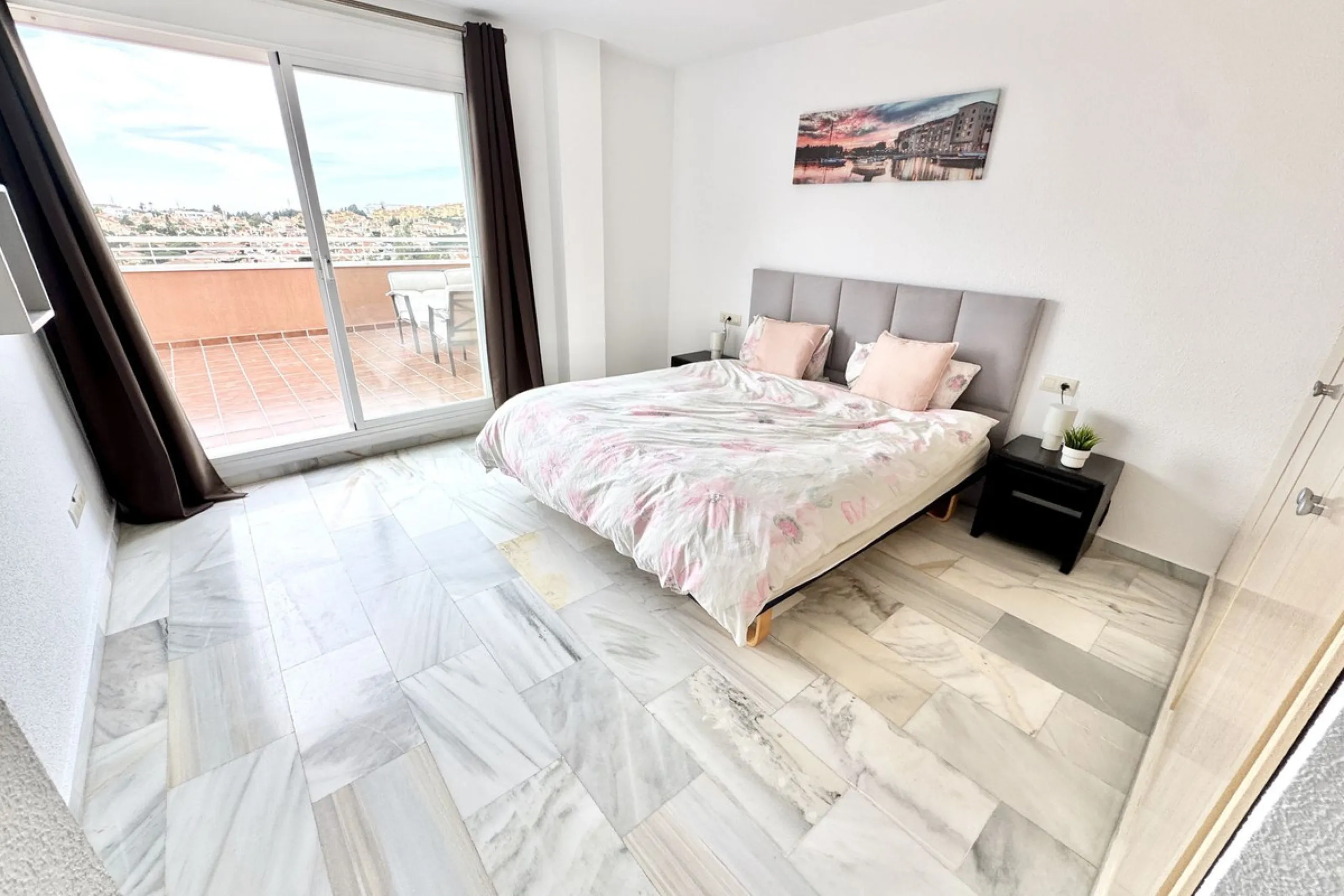 BEST BUY ALERT (Massively Reduced) - 2 bed, 2 bath penthouse in Mijas Costa with enormous 150m2 wrap around terrace / solarium, all with beautiful panoramic sea views.