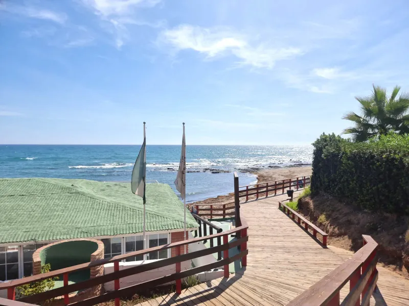 Step into coastal luxury with this exceptional 1-bedroom, 70 m² beachfront apartment, located in the prestigious Miraflores community on the Costa del Sol. Immaculately refurbished to the highest standards, this rare gem offers breathtaking Mediterranean 