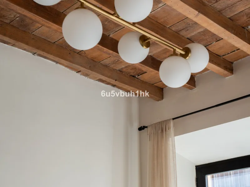 Imagine living in Málaga's historic center, on a wide and quiet street just a stone's throw from Calle Carretería. This apartment has something rare—a feeling of space, privacy, and uplifting light that fills every room. Step out onto any of the three sun