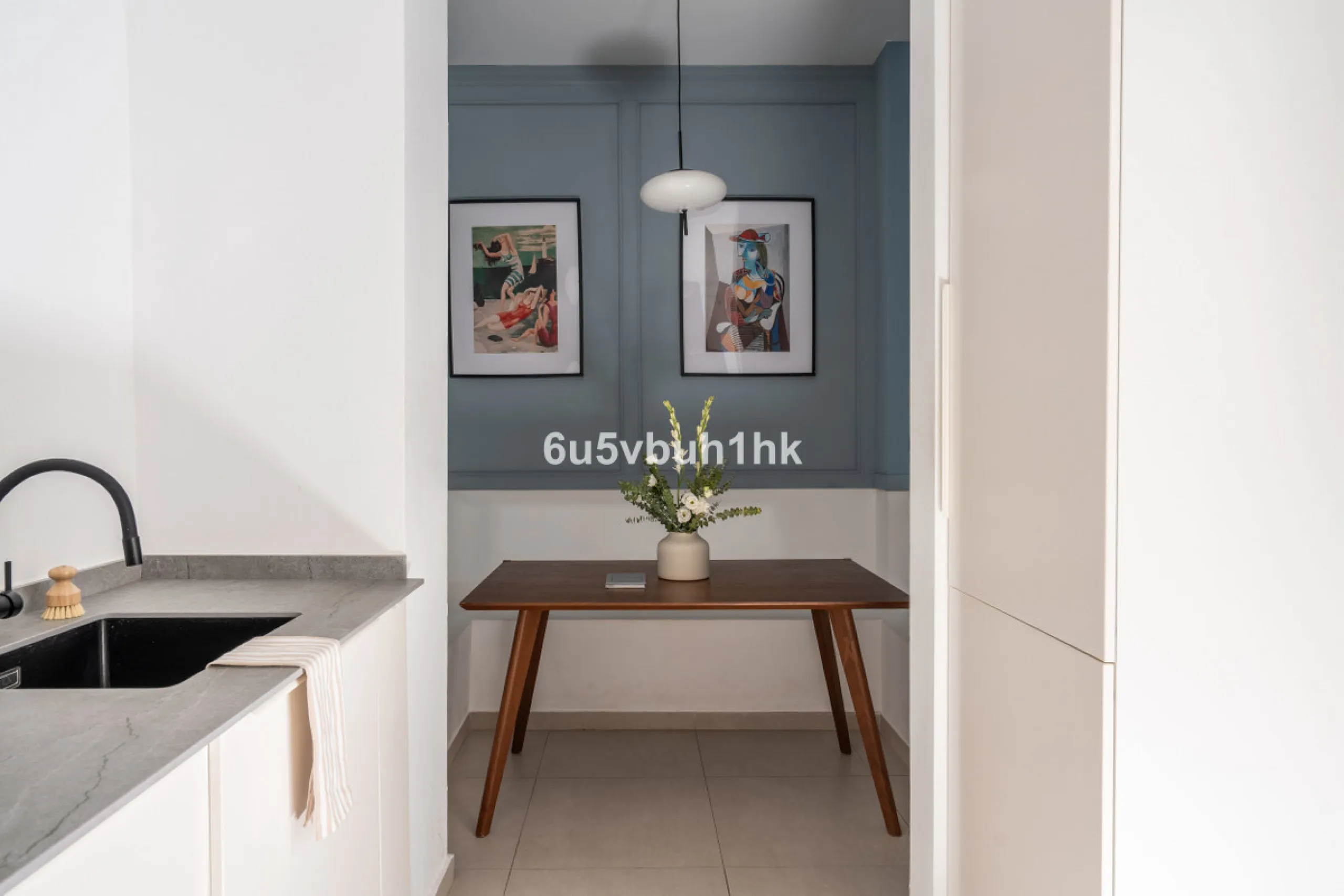 Imagine living in Málaga's historic center, on a wide and quiet street just a stone's throw from Calle Carretería. This apartment has something rare—a feeling of space, privacy, and uplifting light that fills every room. Step out onto any of the three sun