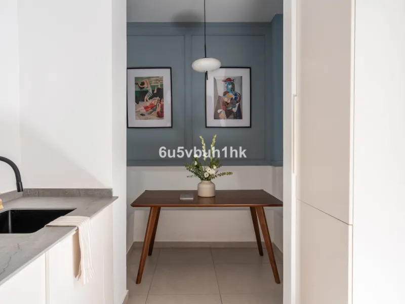 Imagine living in Málaga's historic center, on a wide and quiet street just a stone's throw from Calle Carretería. This apartment has something rare—a feeling of space, privacy, and uplifting light that fills every room. Step out onto any of the three sun