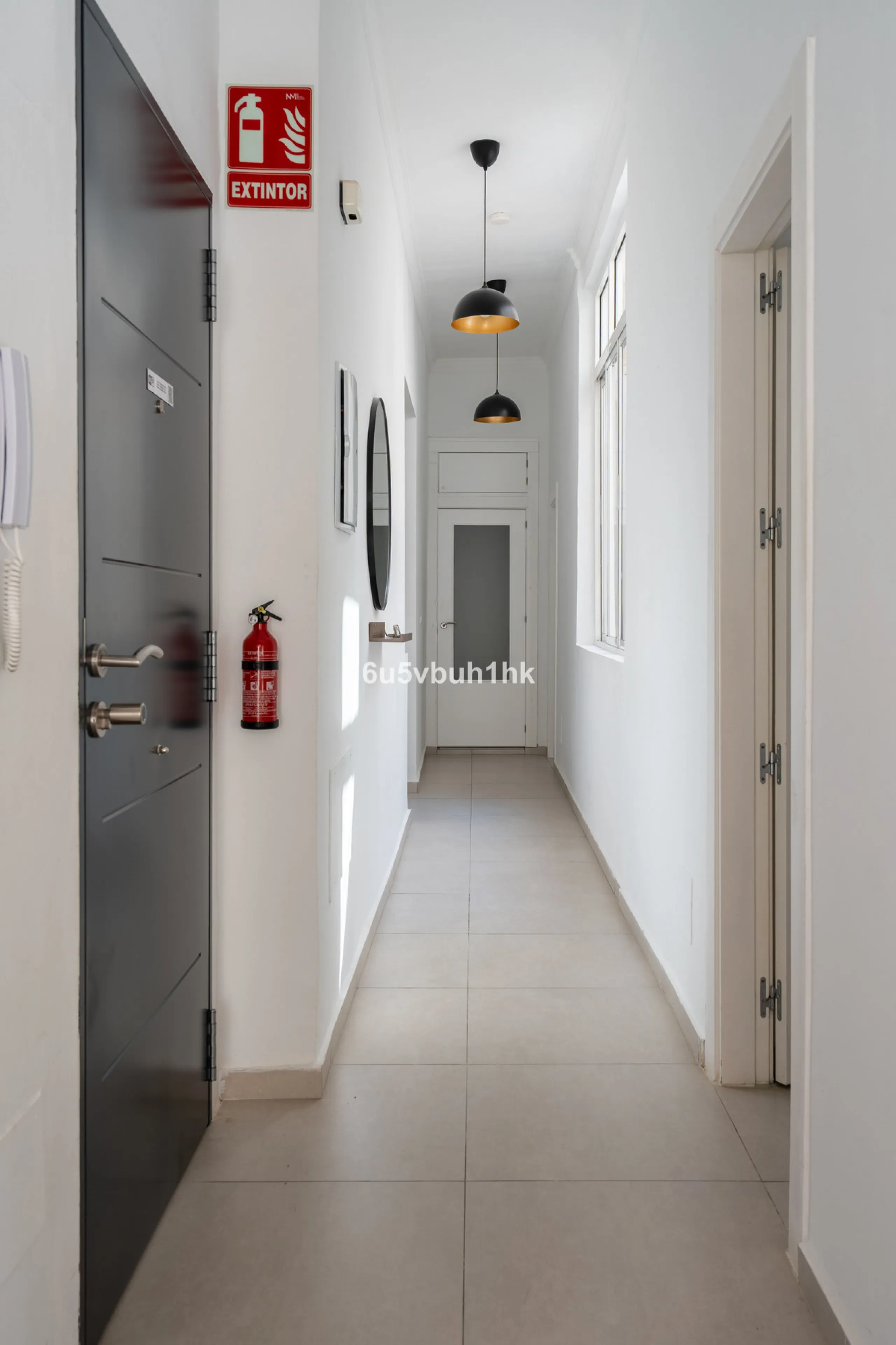 Imagine living in Málaga's historic center, on a wide and quiet street just a stone's throw from Calle Carretería. This apartment has something rare—a feeling of space, privacy, and uplifting light that fills every room. Step out onto any of the three sun