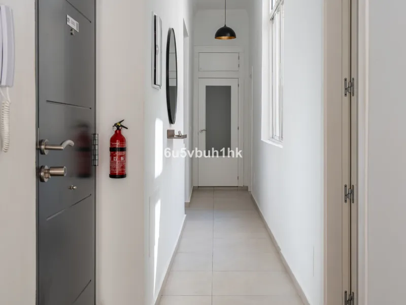 Imagine living in Málaga's historic center, on a wide and quiet street just a stone's throw from Calle Carretería. This apartment has something rare—a feeling of space, privacy, and uplifting light that fills every room. Step out onto any of the three sun