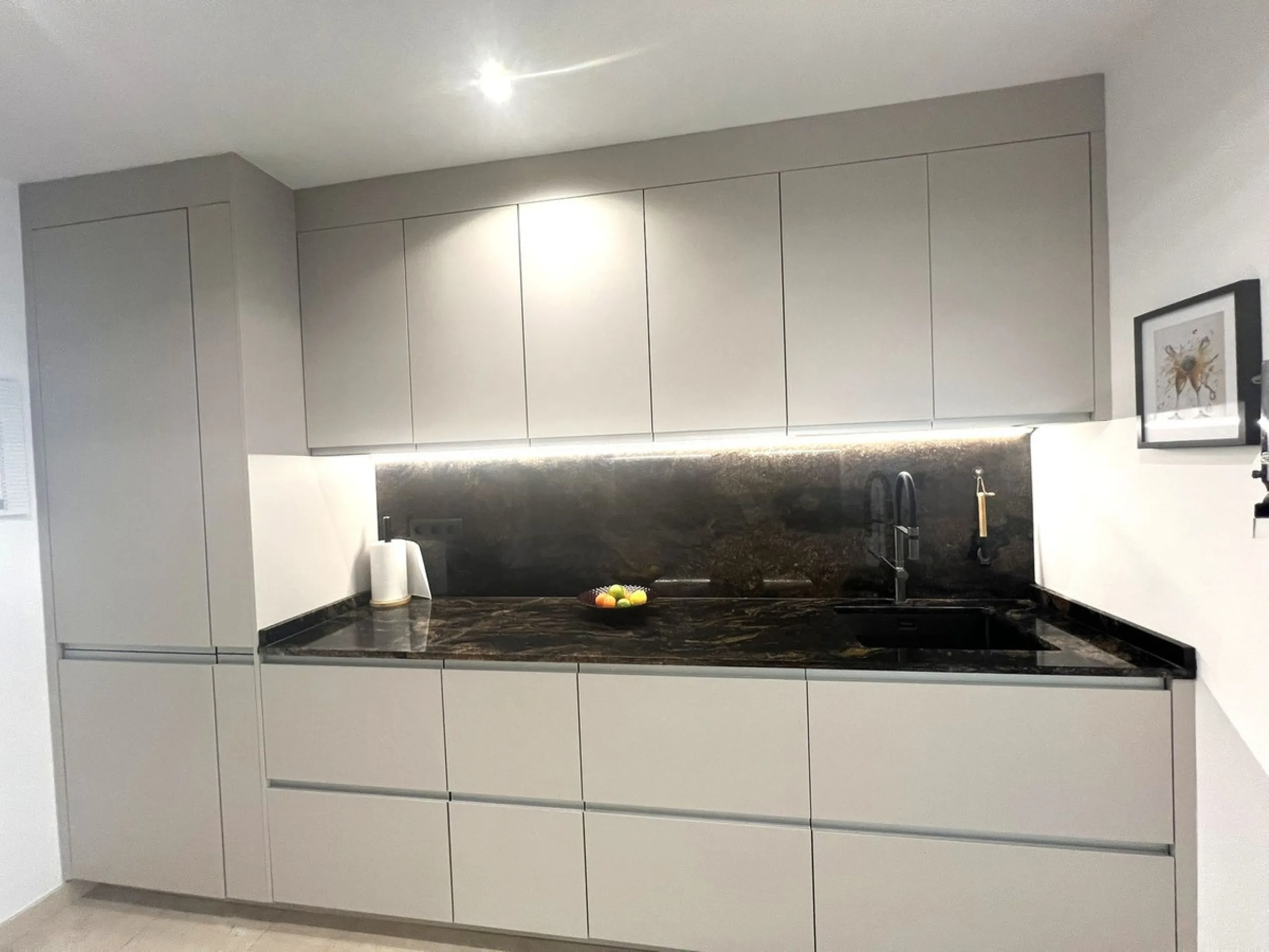 Discover this exceptional first-floor corner apartment, where modern comfort meets breathtaking scenery. Boasting two expansive, glassed in terraces, the residence offers panoramic views that stretch from the sparkling Mediterranean Sea to the majestic su
