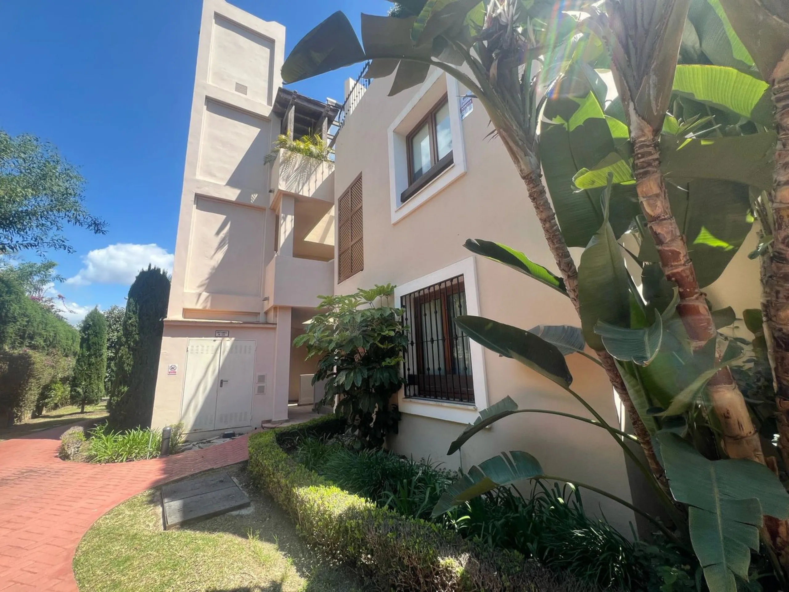 Discover this exceptional first-floor corner apartment, where modern comfort meets breathtaking scenery. Boasting two expansive, glassed in terraces, the residence offers panoramic views that stretch from the sparkling Mediterranean Sea to the majestic su