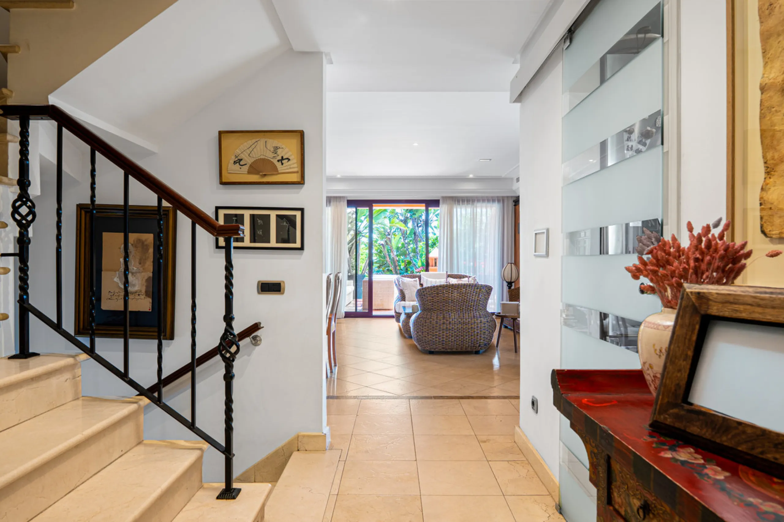 Townhouse Oasis is a five-bedroom luxury home in one of Marbella's most prestigious gated communities on the Golden Mile. Surrounded by tropical gardens, this townhouse offers privacy, comfort, and Mediterranean charm. With multiple terraces, a private ga