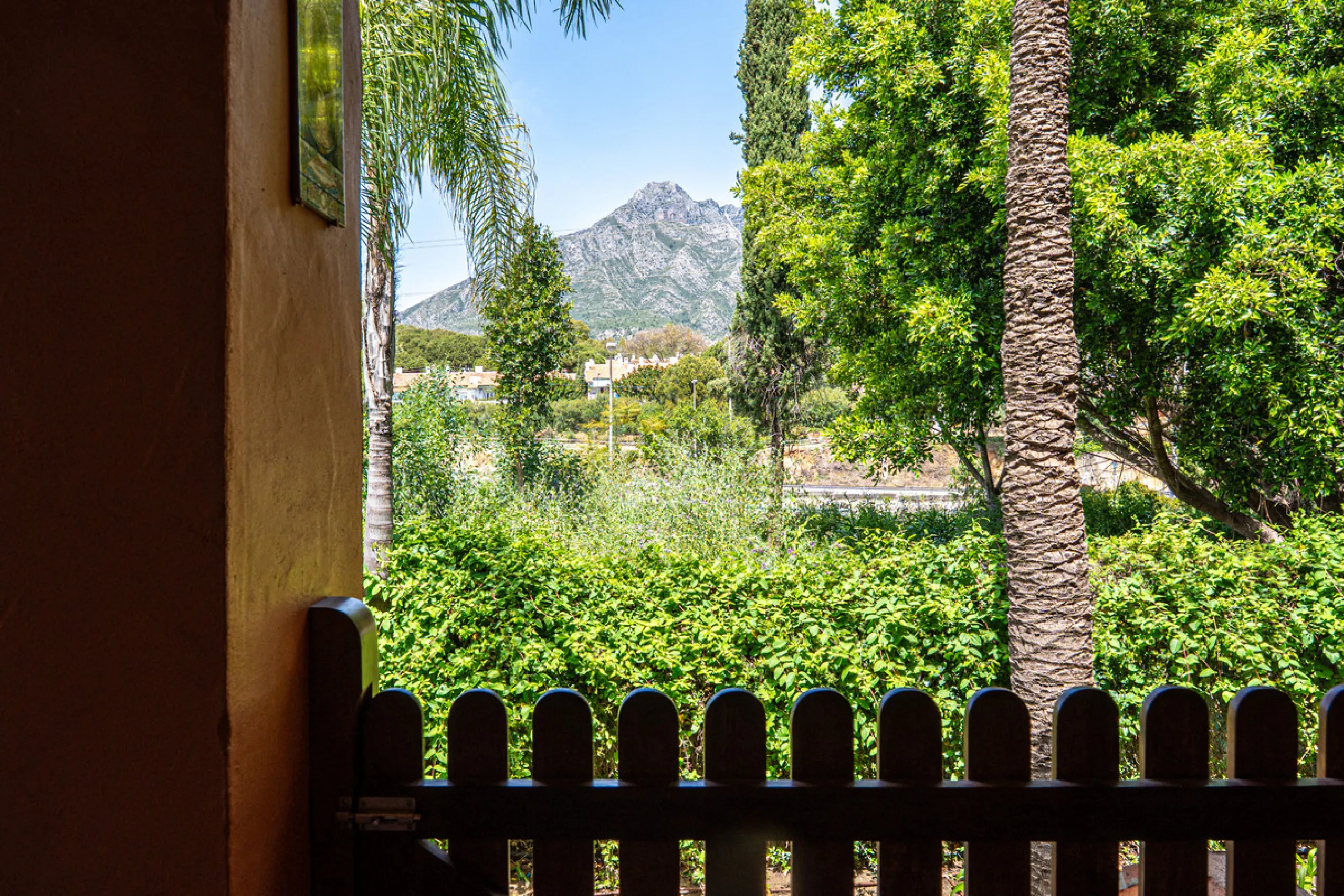 Townhouse Oasis is a five-bedroom luxury home in one of Marbella's most prestigious gated communities on the Golden Mile. Surrounded by tropical gardens, this townhouse offers privacy, comfort, and Mediterranean charm. With multiple terraces, a private ga