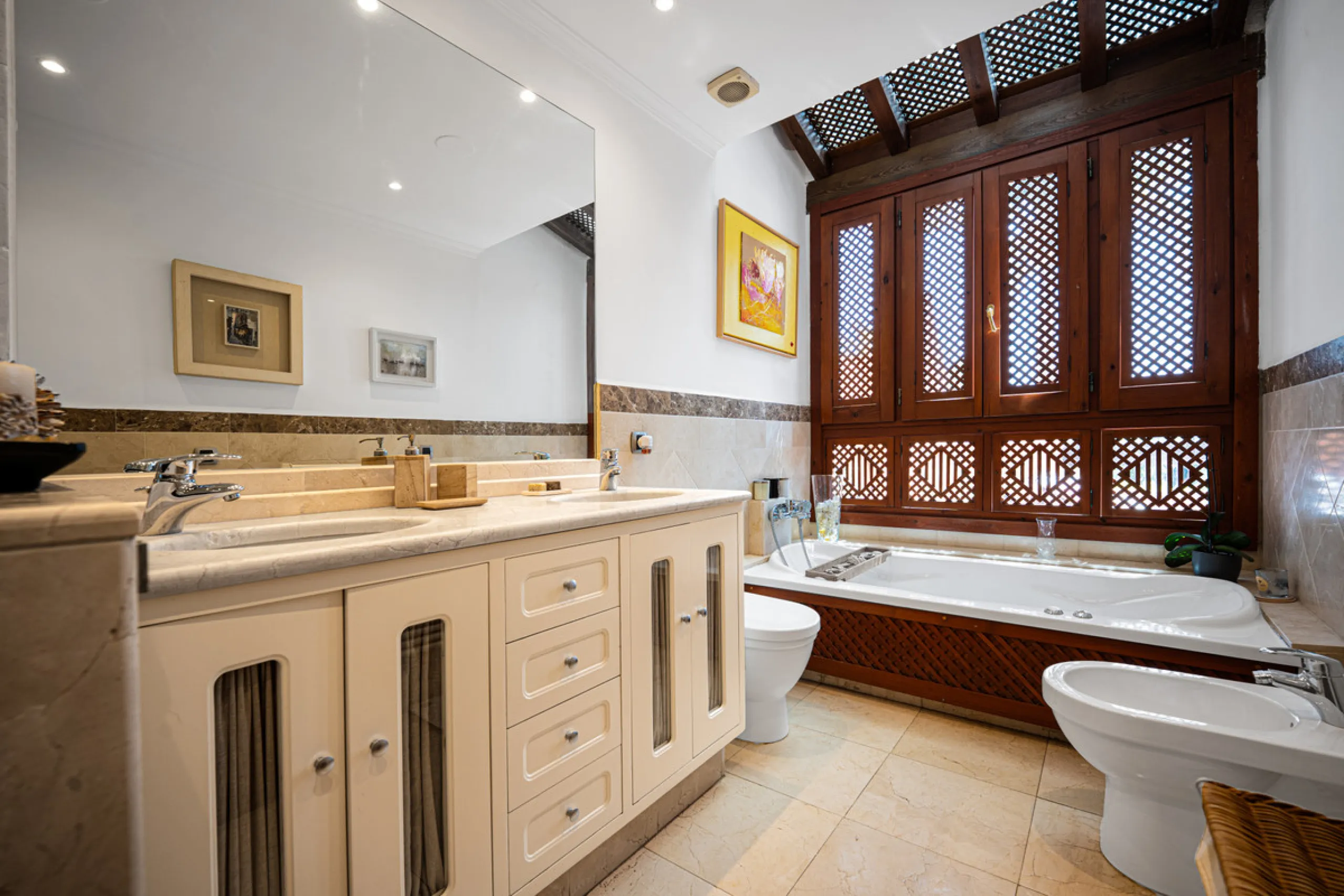 Townhouse Oasis is a five-bedroom luxury home in one of Marbella's most prestigious gated communities on the Golden Mile. Surrounded by tropical gardens, this townhouse offers privacy, comfort, and Mediterranean charm. With multiple terraces, a private ga