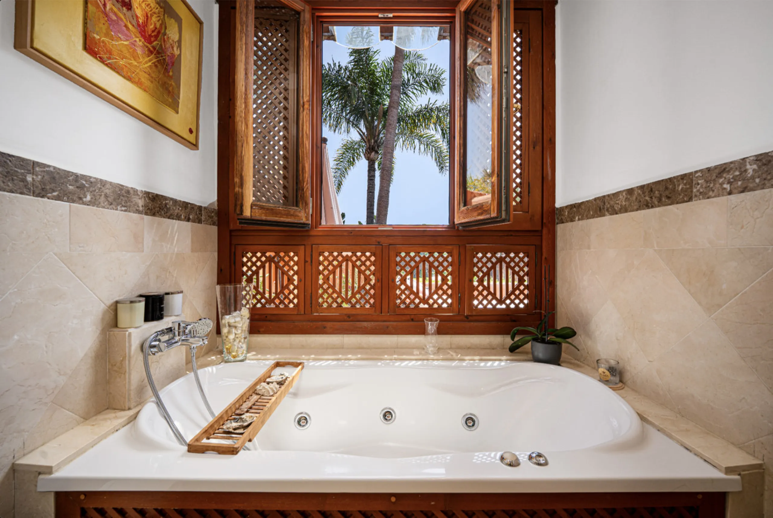 Townhouse Oasis is a five-bedroom luxury home in one of Marbella's most prestigious gated communities on the Golden Mile. Surrounded by tropical gardens, this townhouse offers privacy, comfort, and Mediterranean charm. With multiple terraces, a private ga