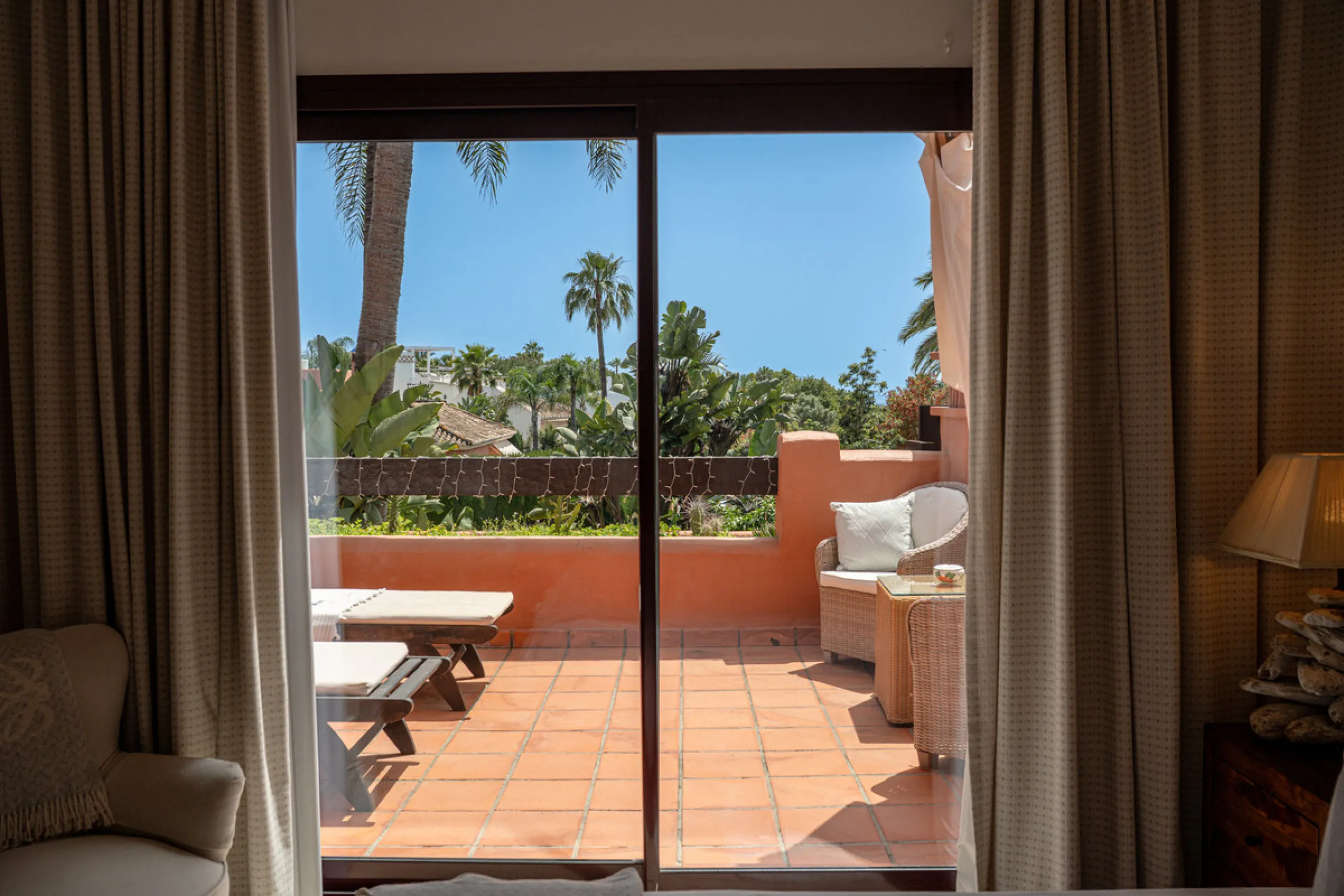 Townhouse Oasis is a five-bedroom luxury home in one of Marbella's most prestigious gated communities on the Golden Mile. Surrounded by tropical gardens, this townhouse offers privacy, comfort, and Mediterranean charm. With multiple terraces, a private ga