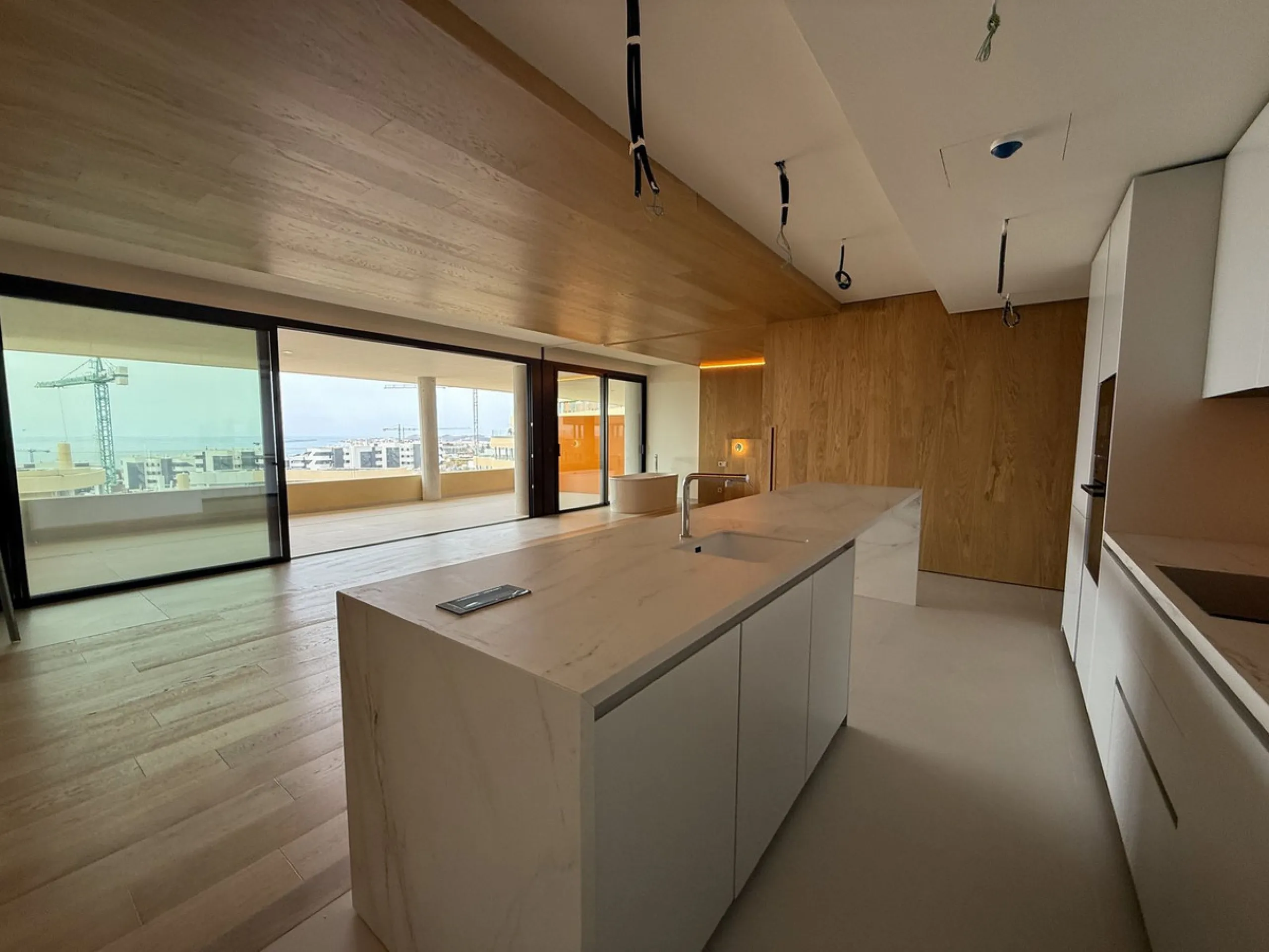 Be among the very first to reserve this stunning brand-new, just-completed 3-bed, 2-bath apartment. Spread across 140 m² built, the open-plan living and kitchen area is bright and spacious, with floor-to-ceiling sliding glass doors that seamlessly extend 