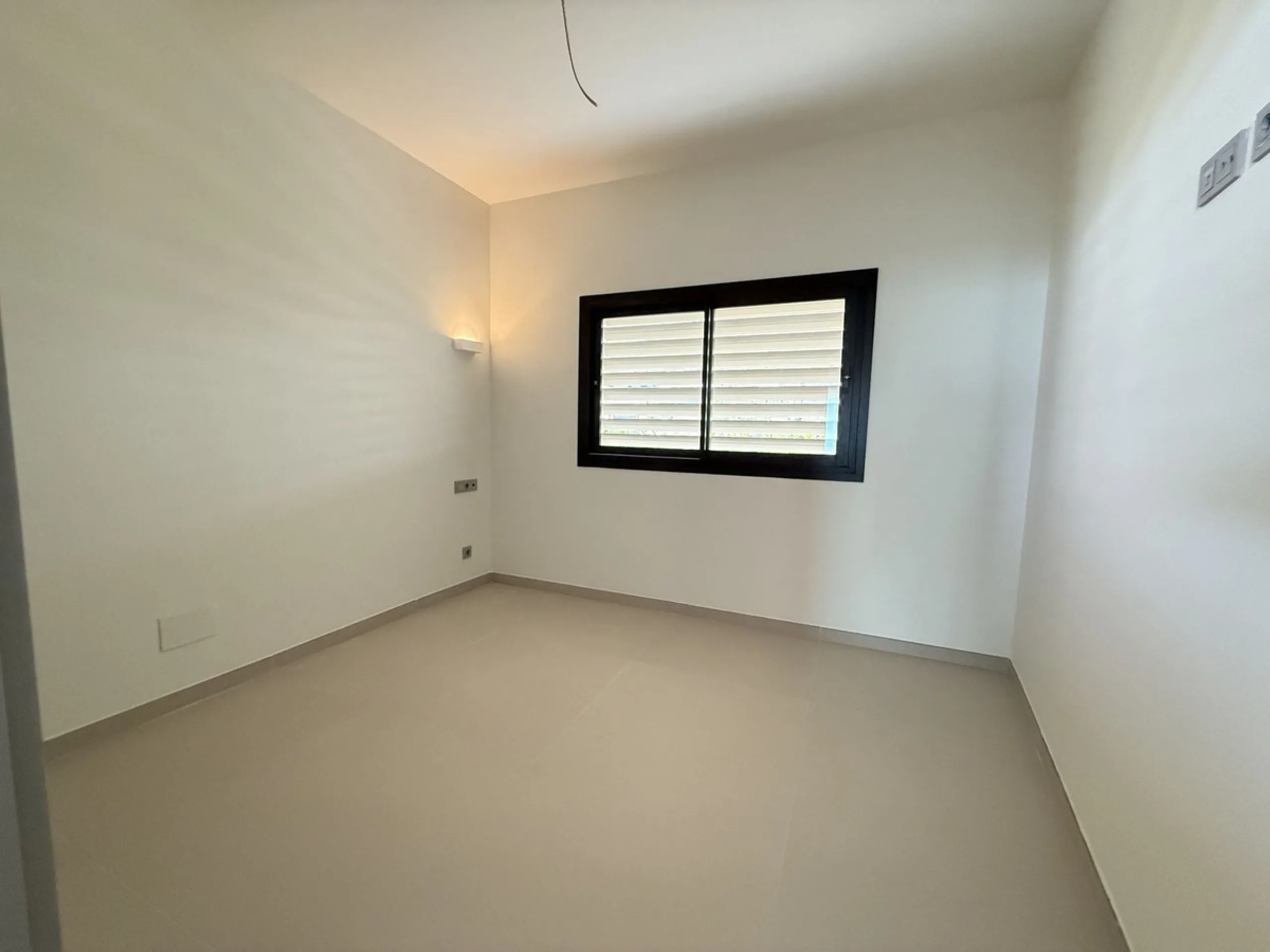 Be among the very first to reserve this stunning brand-new, just-completed 3-bed, 2-bath apartment. Spread across 140 m² built, the open-plan living and kitchen area is bright and spacious, with floor-to-ceiling sliding glass doors that seamlessly extend 