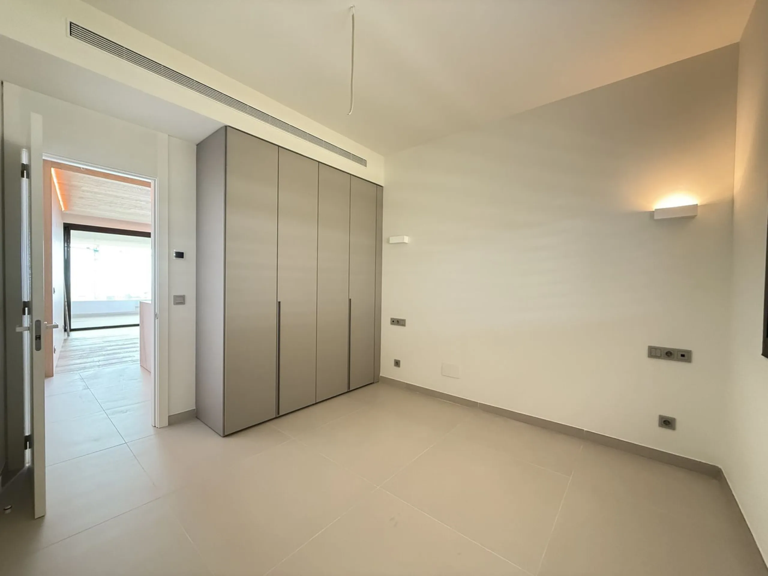 Be among the very first to reserve this stunning brand-new, just-completed 3-bed, 2-bath apartment. Spread across 140 m² built, the open-plan living and kitchen area is bright and spacious, with floor-to-ceiling sliding glass doors that seamlessly extend 