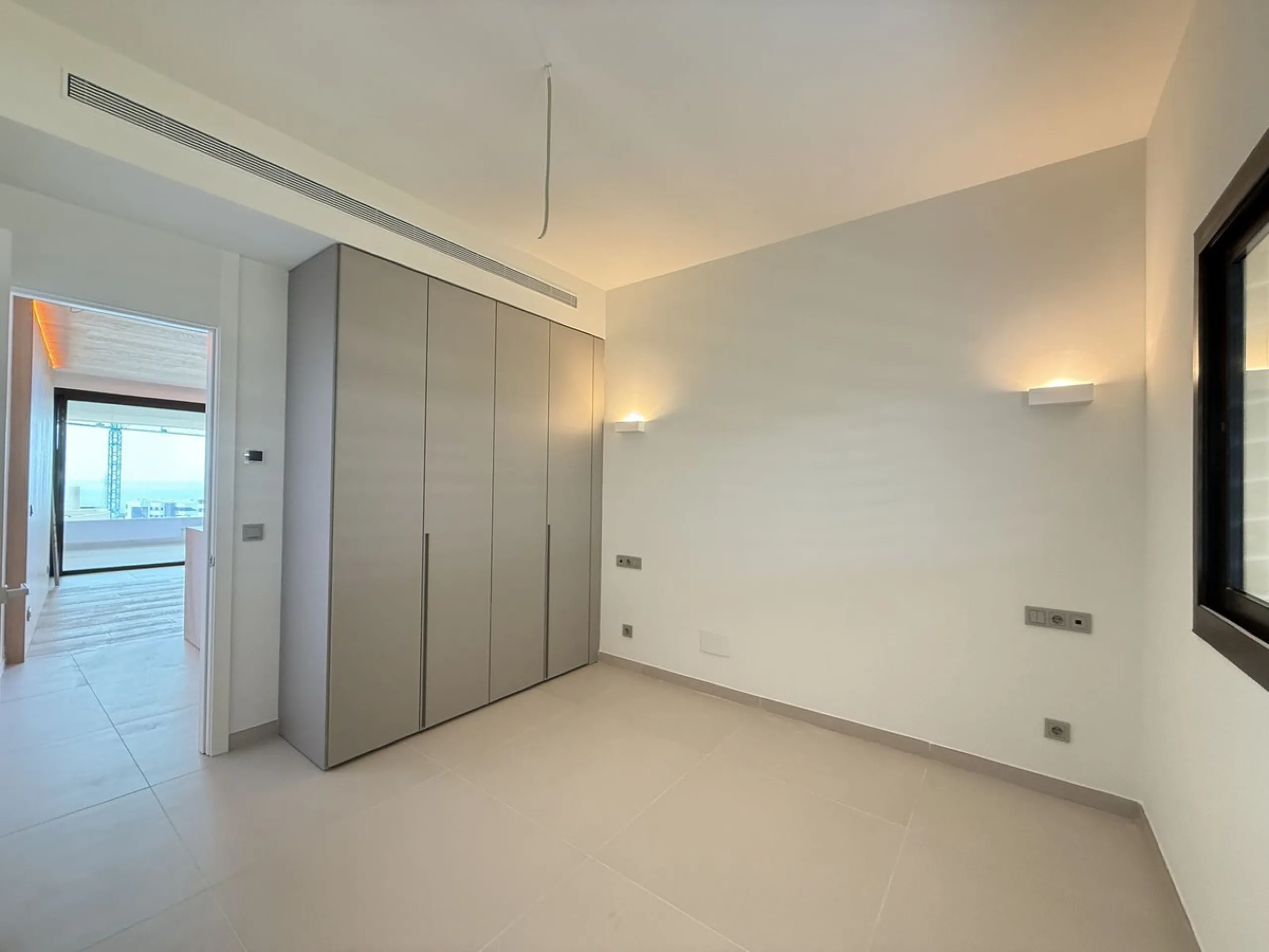Be among the very first to reserve this stunning brand-new, just-completed 3-bed, 2-bath apartment. Spread across 140 m² built, the open-plan living and kitchen area is bright and spacious, with floor-to-ceiling sliding glass doors that seamlessly extend 