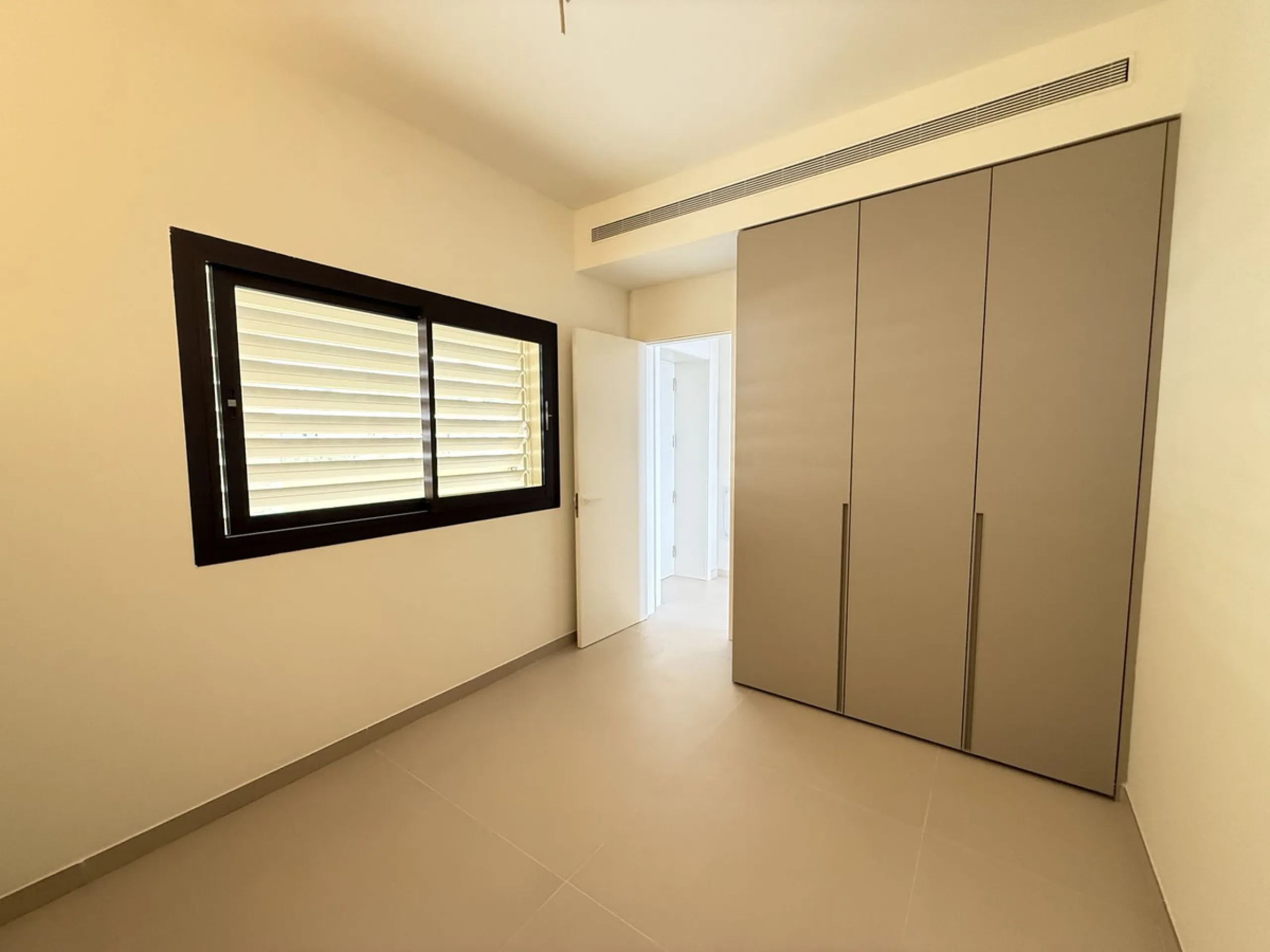 Be among the very first to reserve this stunning brand-new, just-completed 3-bed, 2-bath apartment. Spread across 140 m² built, the open-plan living and kitchen area is bright and spacious, with floor-to-ceiling sliding glass doors that seamlessly extend 