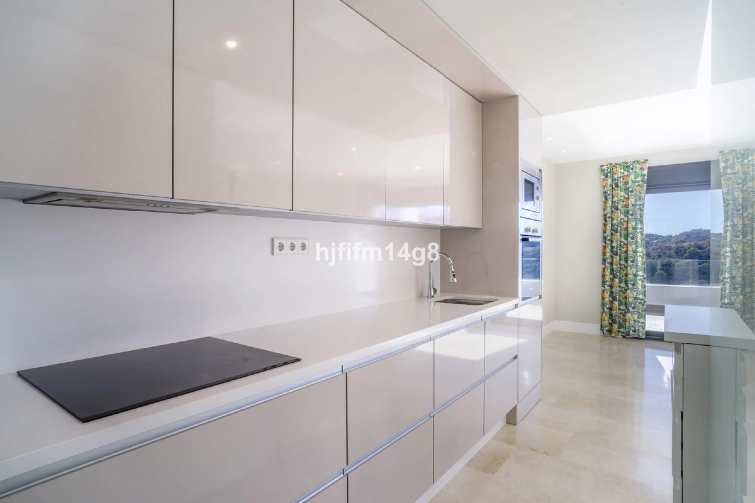 This stunning 2-bedroom duplex penthouse for sale in Ocean Hills, Estepona offers modern, luxurious living with breathtaking panoramic views of the Mediterranean Sea, the surrounding mountains, and the protected natural park that borders the community. Si