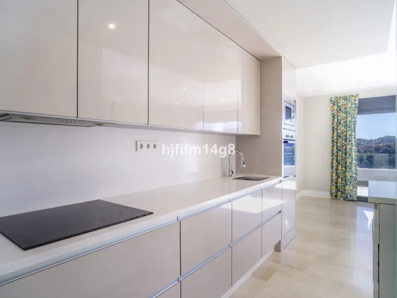 This stunning 2-bedroom duplex penthouse for sale in Ocean Hills, Estepona offers modern, luxurious living with breathtaking panoramic views of the Mediterranean Sea, the surrounding mountains, and the protected natural park that borders the community. Si