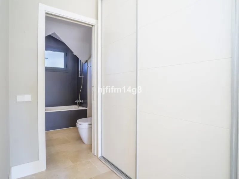 This stunning 2-bedroom duplex penthouse for sale in Ocean Hills, Estepona offers modern, luxurious living with breathtaking panoramic views of the Mediterranean Sea, the surrounding mountains, and the protected natural park that borders the community. Si