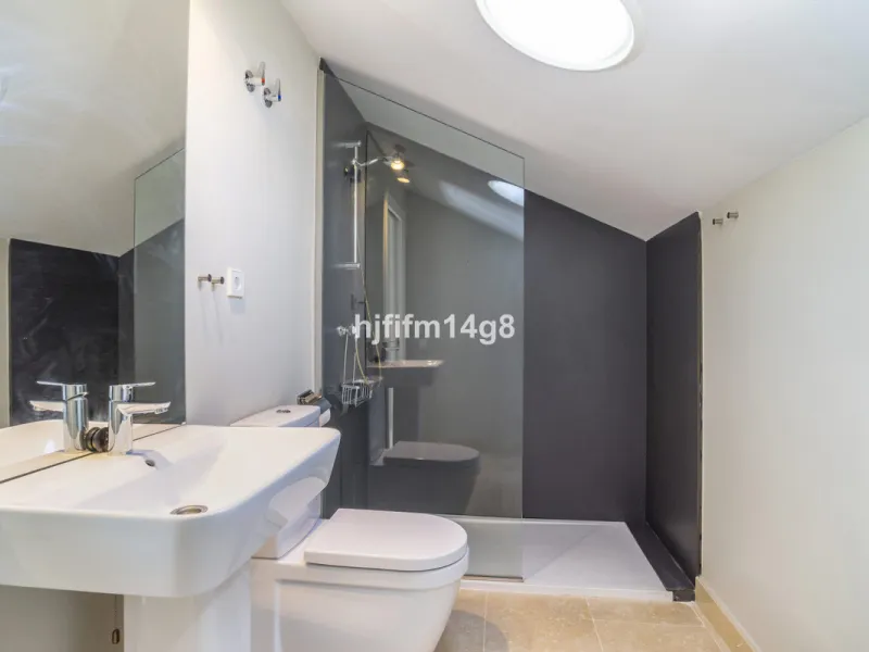 This stunning 2-bedroom duplex penthouse for sale in Ocean Hills, Estepona offers modern, luxurious living with breathtaking panoramic views of the Mediterranean Sea, the surrounding mountains, and the protected natural park that borders the community. Si
